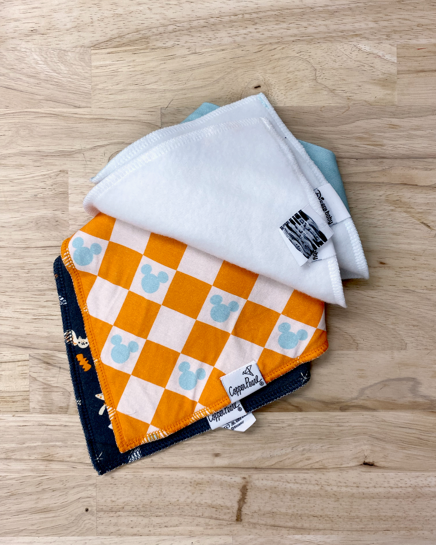 Disney print copper pearl bib set