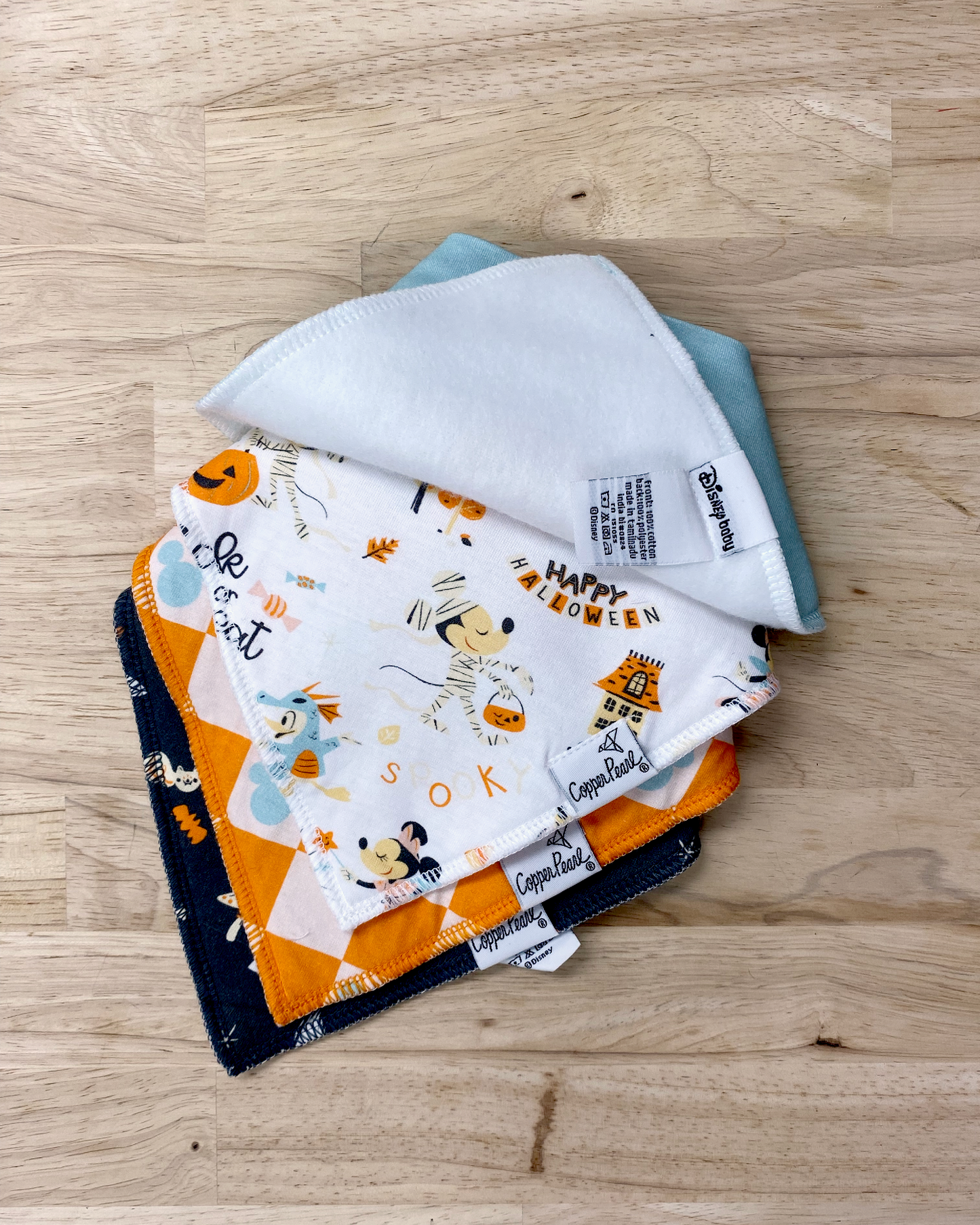 Disney print copper pearl bib set