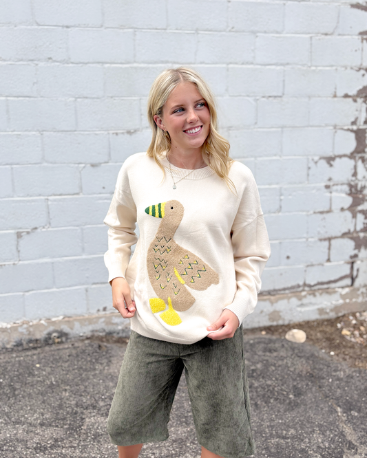 Ivory sweater with appliqué duck on the front