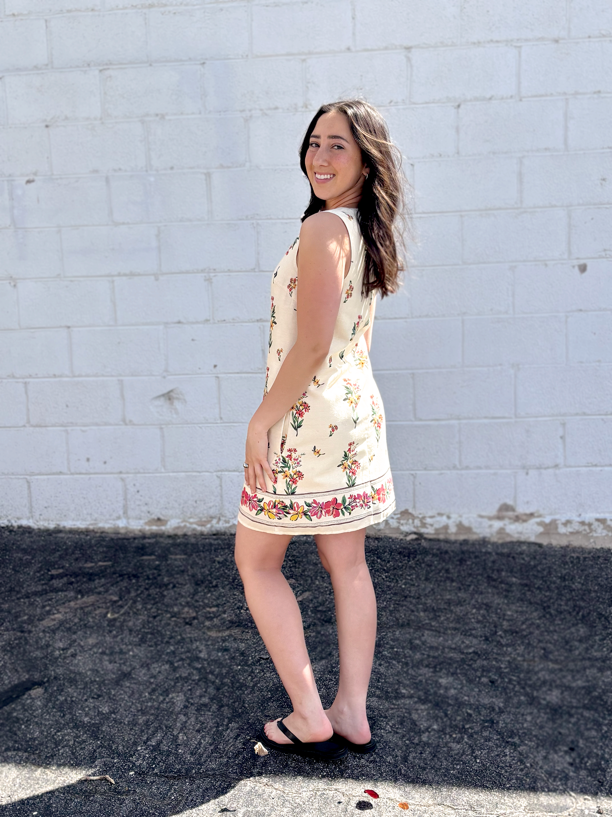 Cute short sleeveless dress with floral pattern