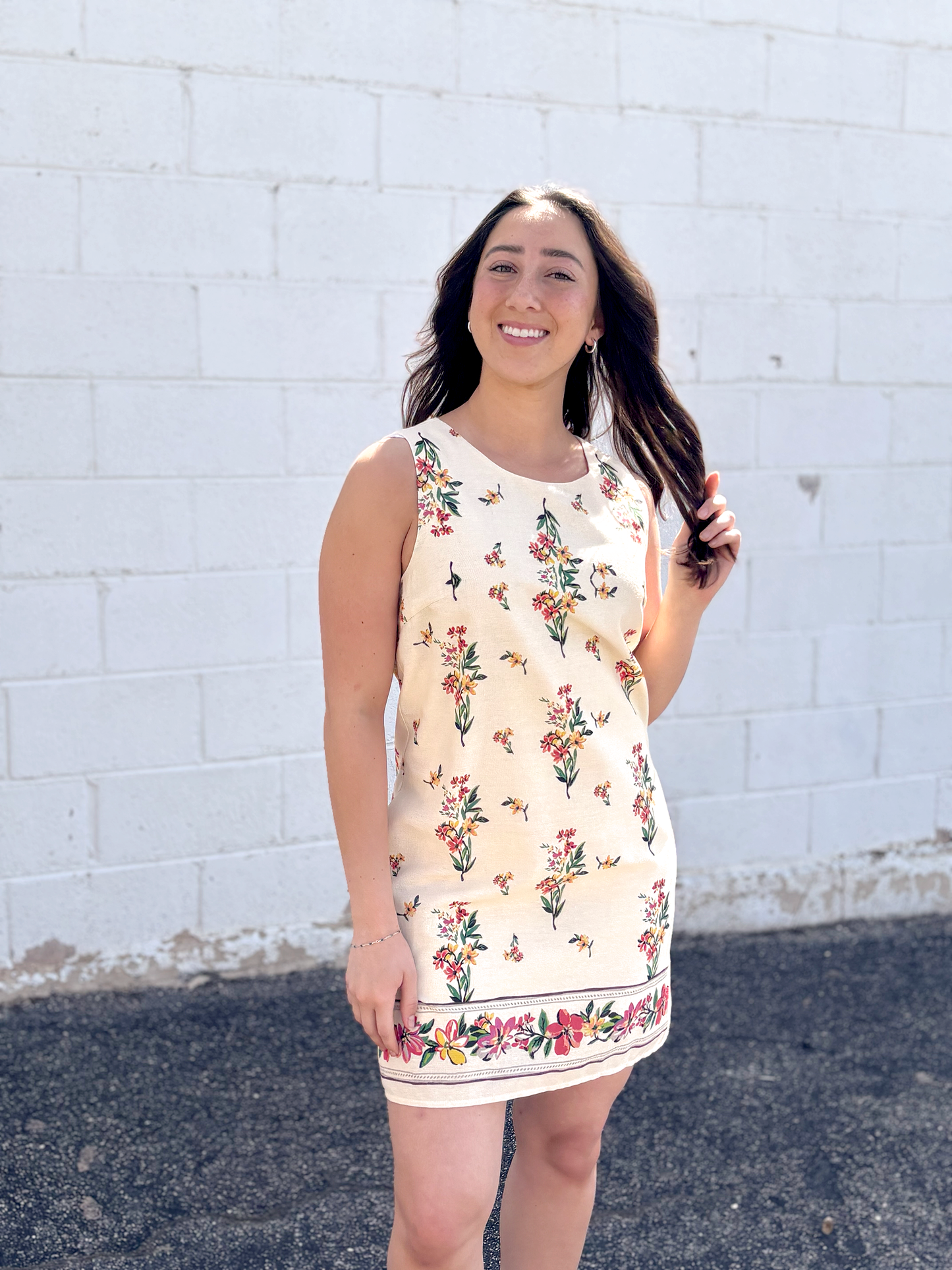 Cute short sleeveless dress with floral pattern