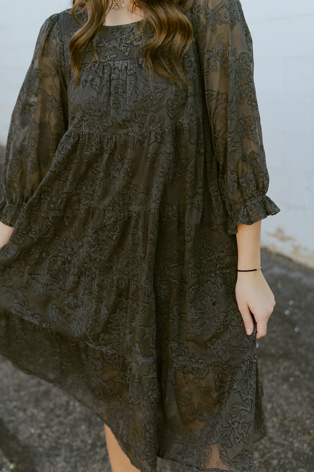 Gray dress with gray embroidered floral pattern all over