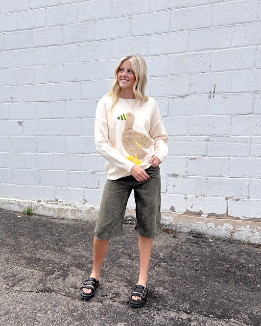 Green corduroy long shorts