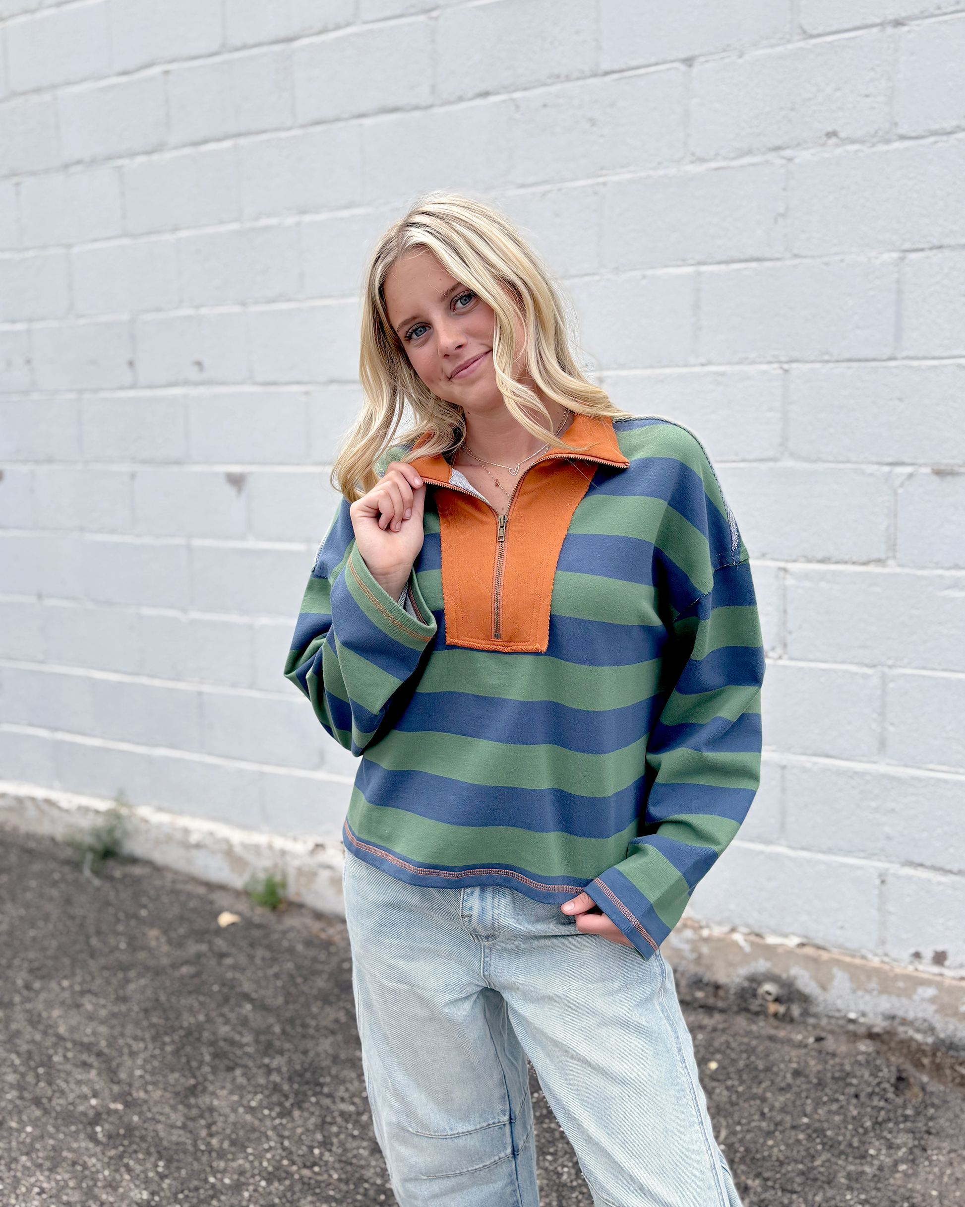 Green and blue striped half zip sweater