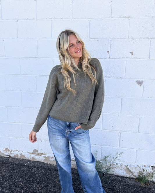 grey green sweater with long sleeves and half zip