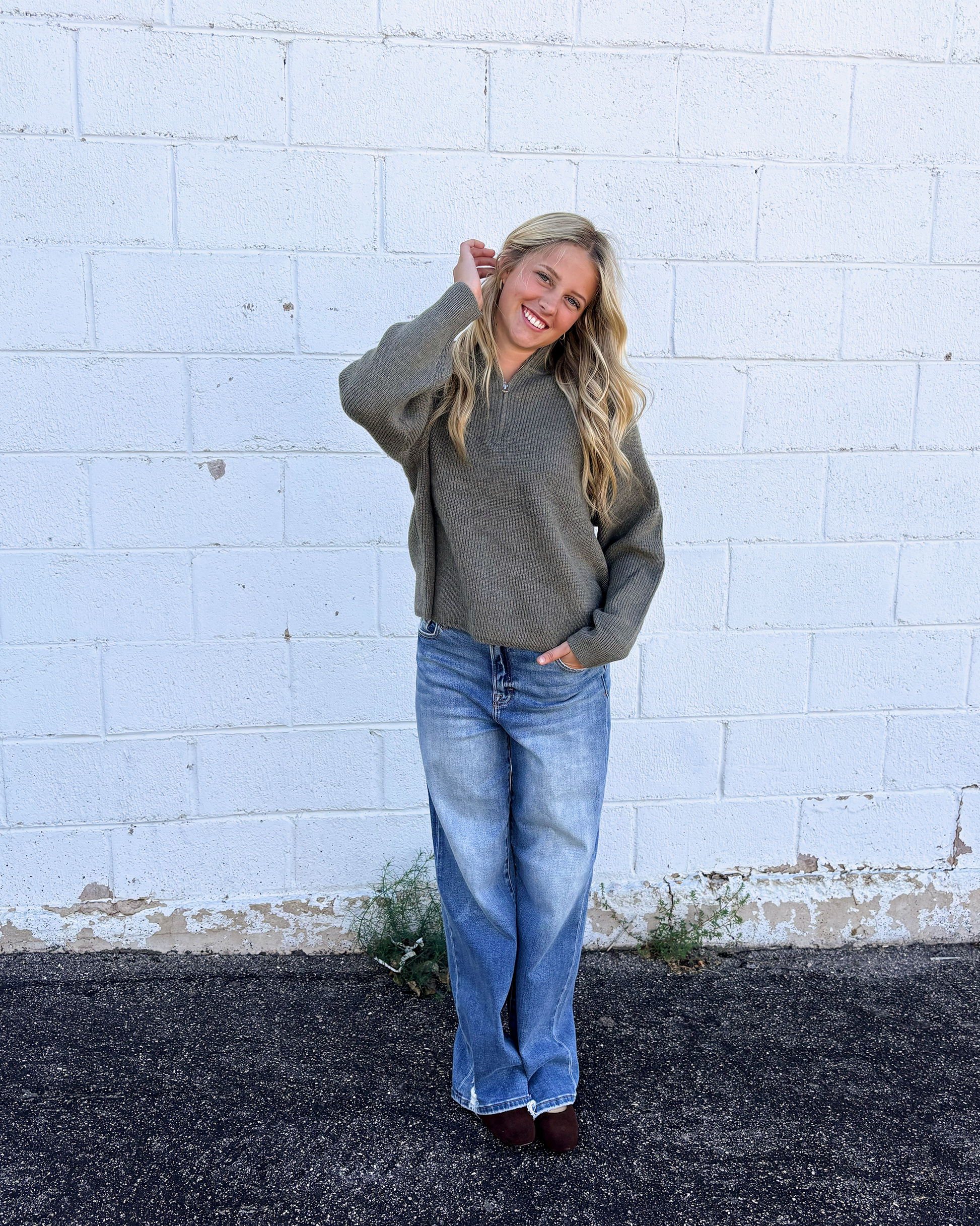 grey green sweater with long sleeves and half zip