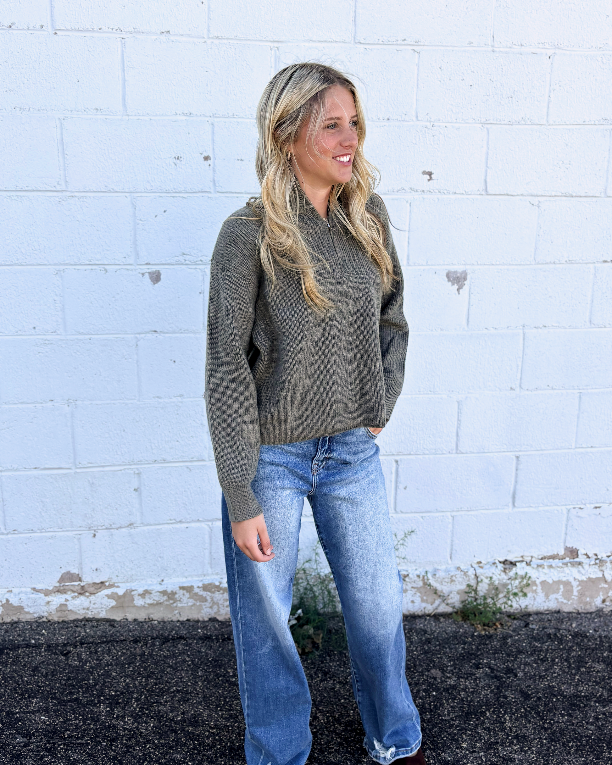 grey green sweater with long sleeves and half zip