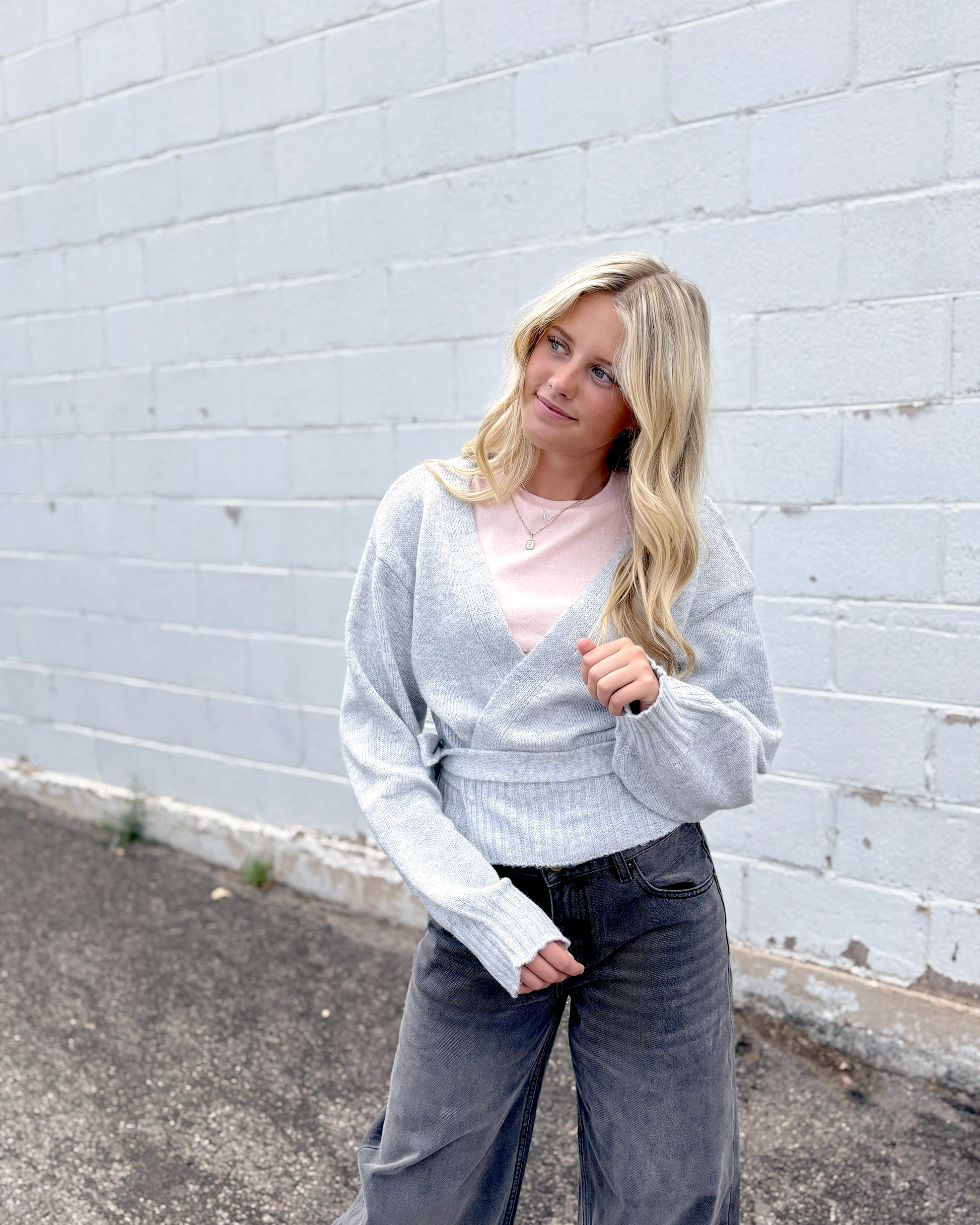 Grey wrap sweater with long sleeves