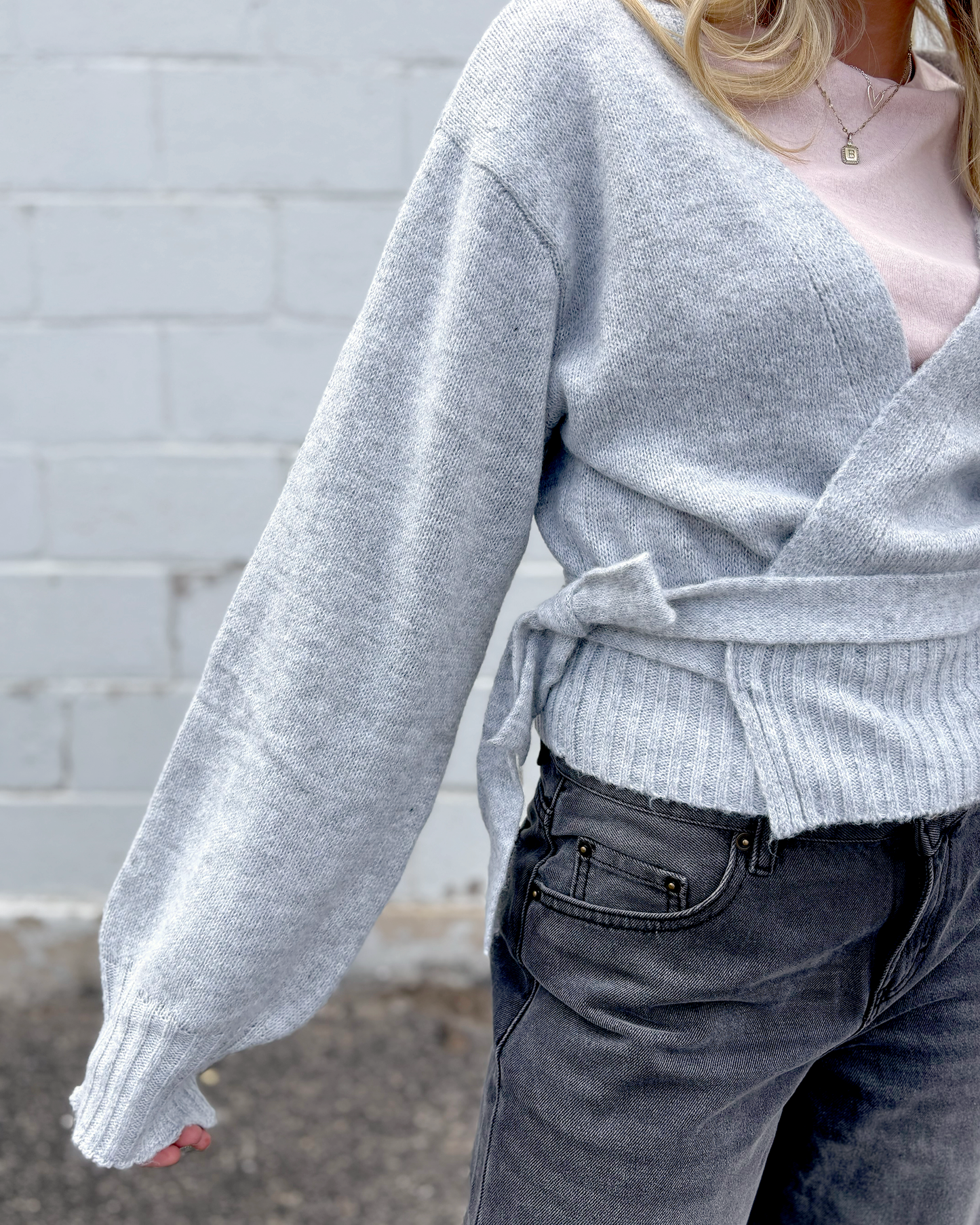 Grey wrap sweater with long sleeves