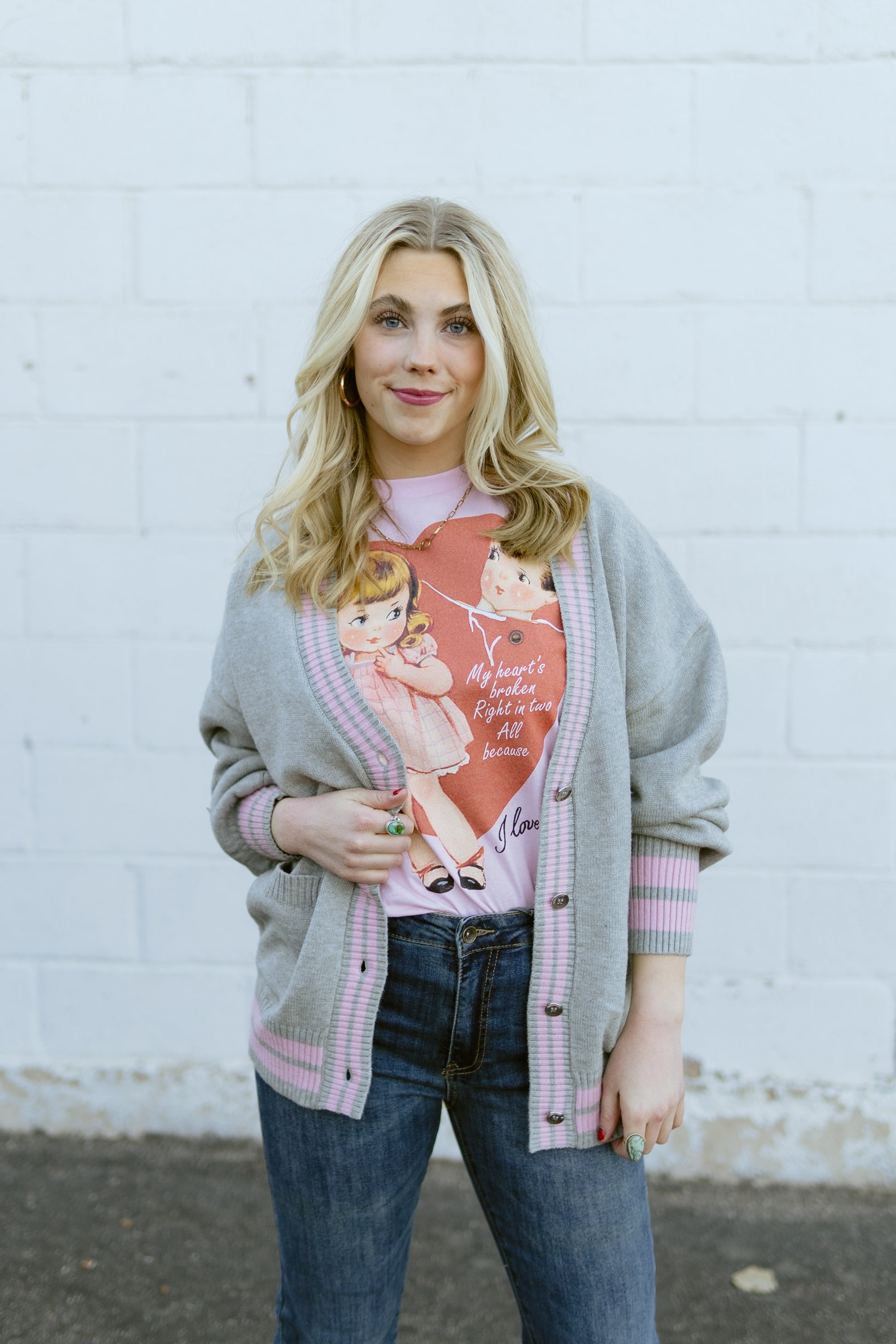 grey knit cardigan with pink stripe detail