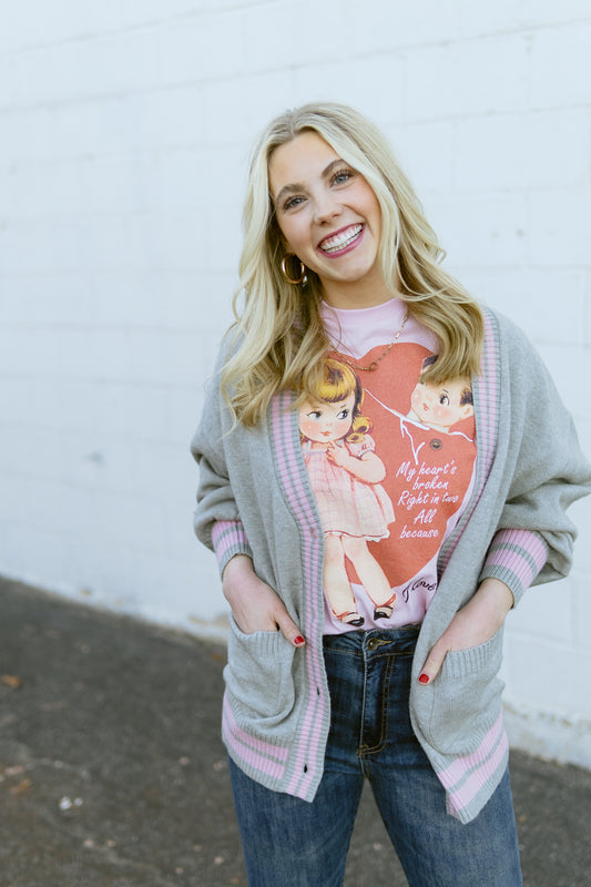 grey knit cardigan with pink stripe detail