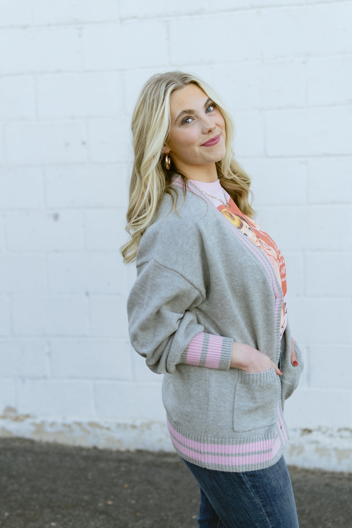 grey knit cardigan with pink stripe detail