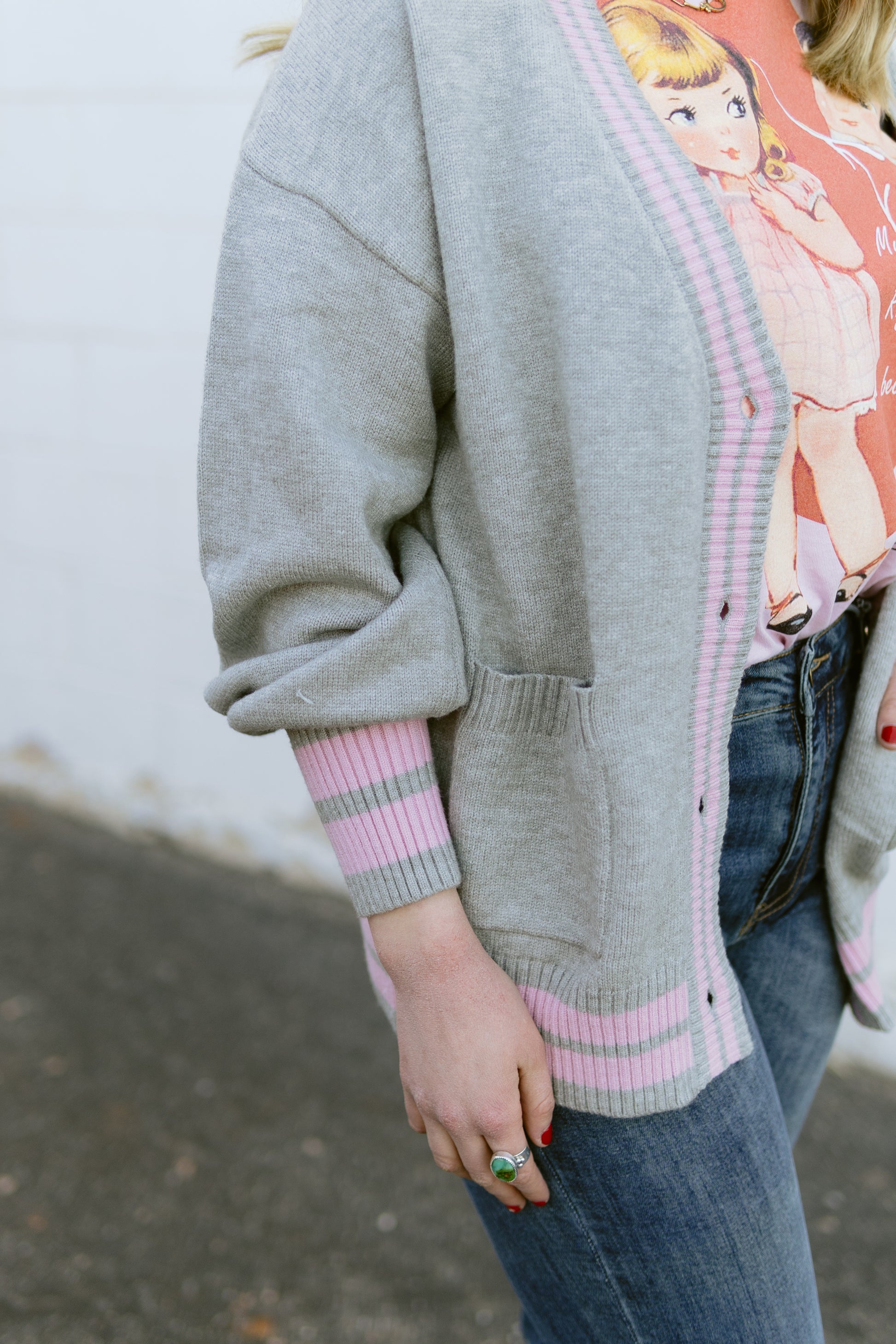 grey knit cardigan with pink stripe detail