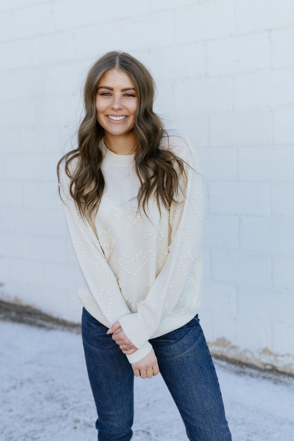 Ivory Sweater with embossed heart pattern over top