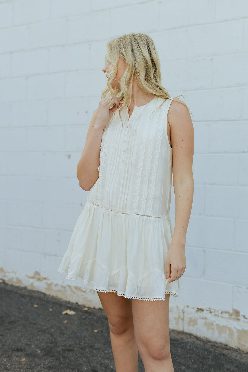 Ivory dress with pin tucks and pleats