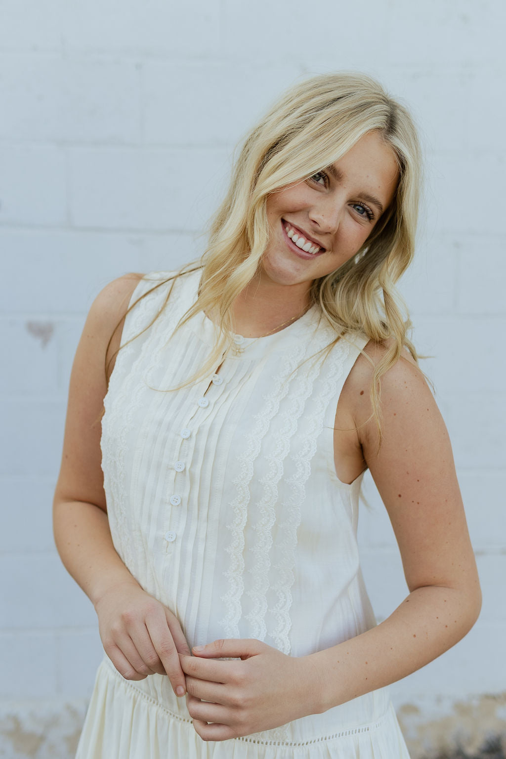 Ivory dress with pin tucks and pleats