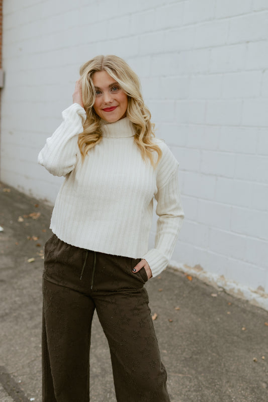 Ivory colored slightly cropped turtleneck