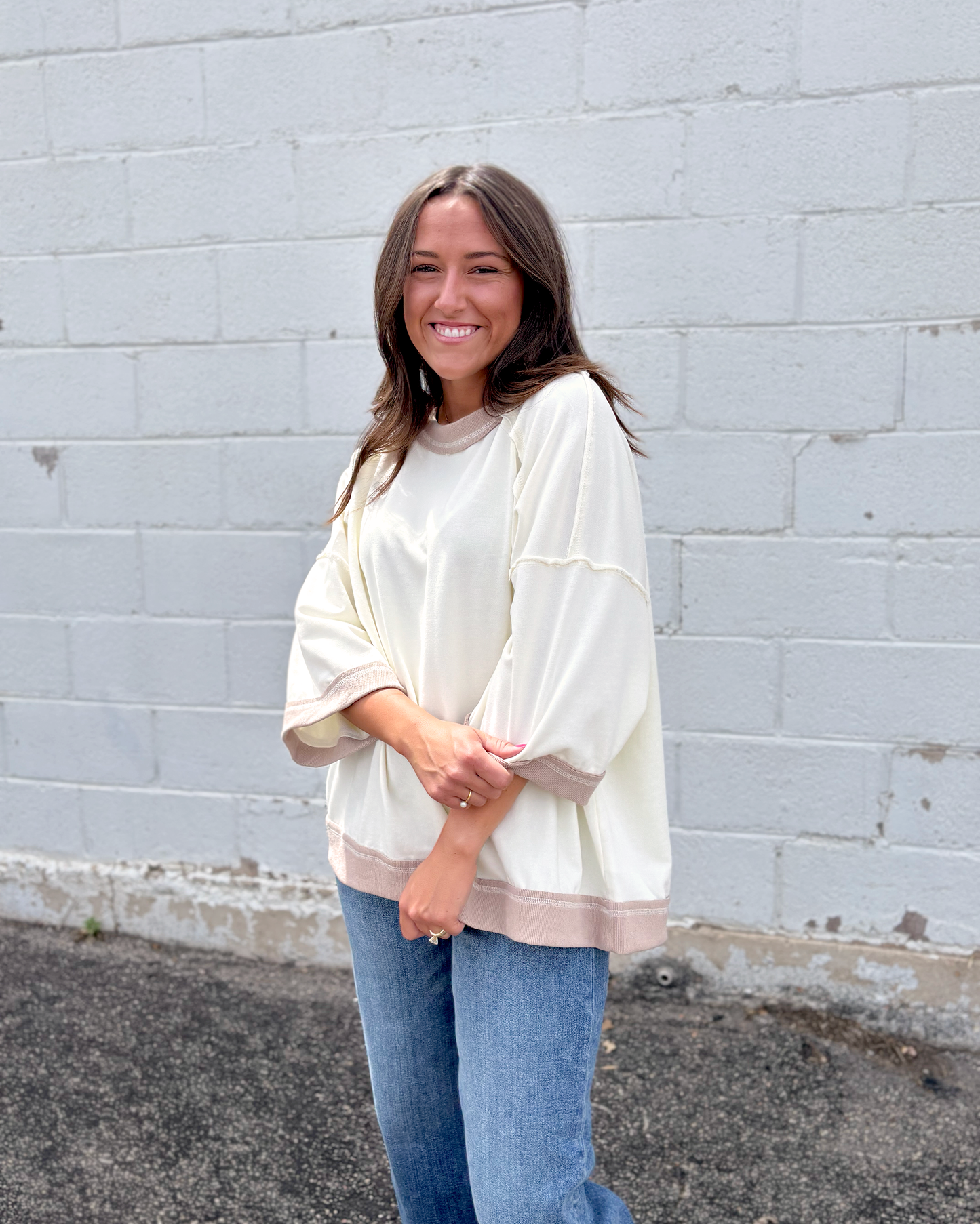 Ivory oversized sweater with beige trim