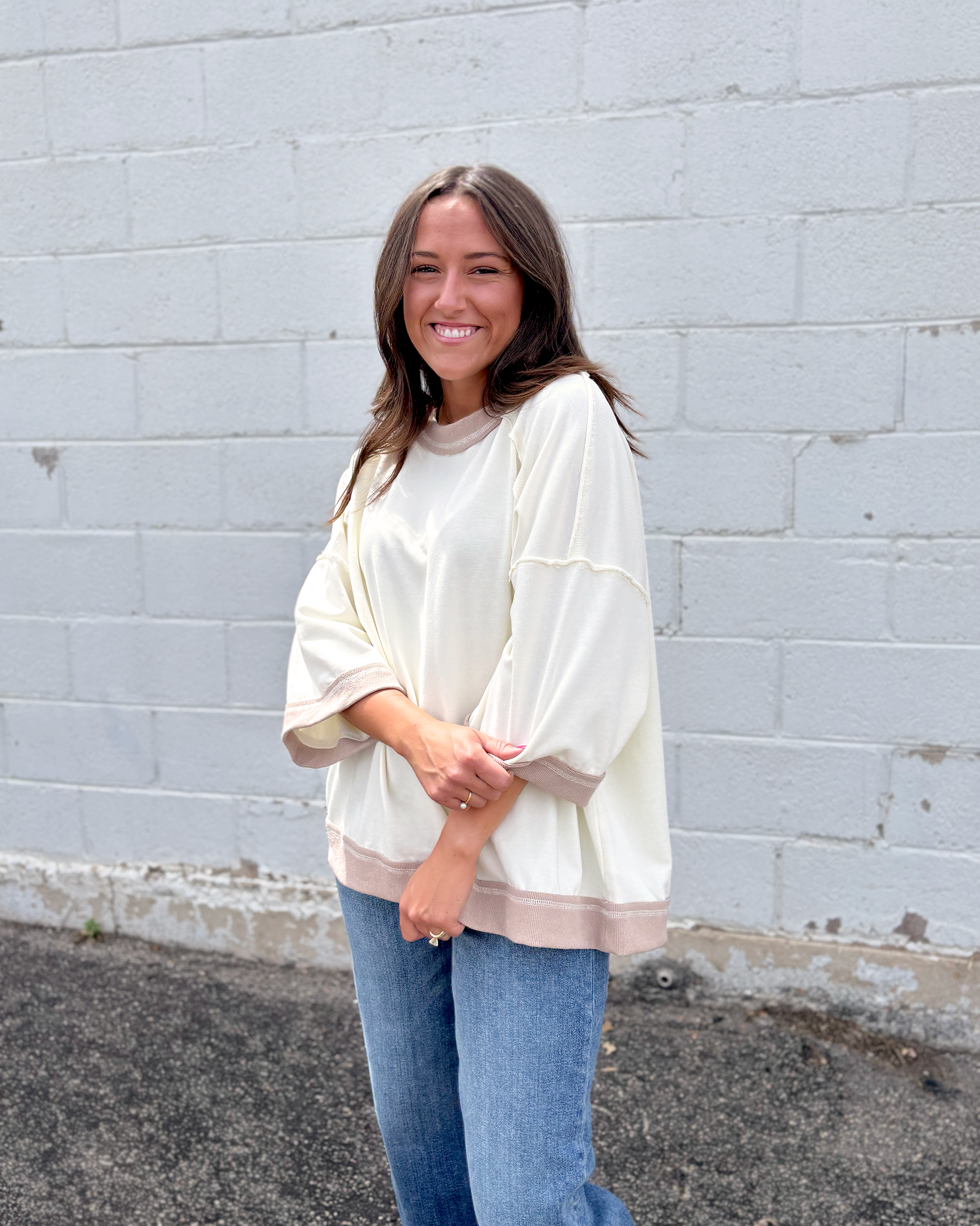 Ivory oversized sweater with beige trim