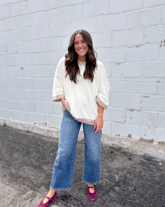 Ivory oversized sweater with beige trim
