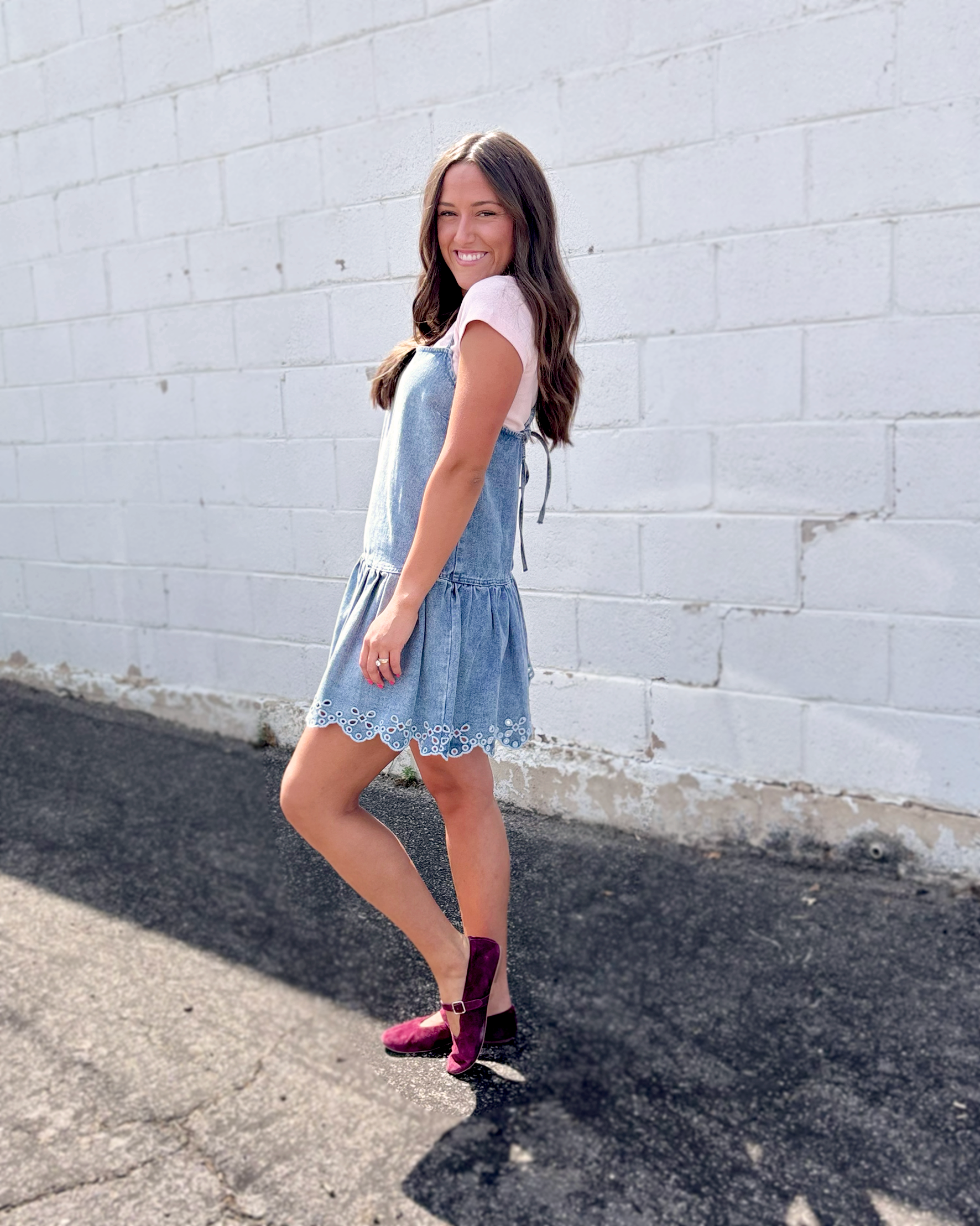 light blue denim pinafore-style mini dress