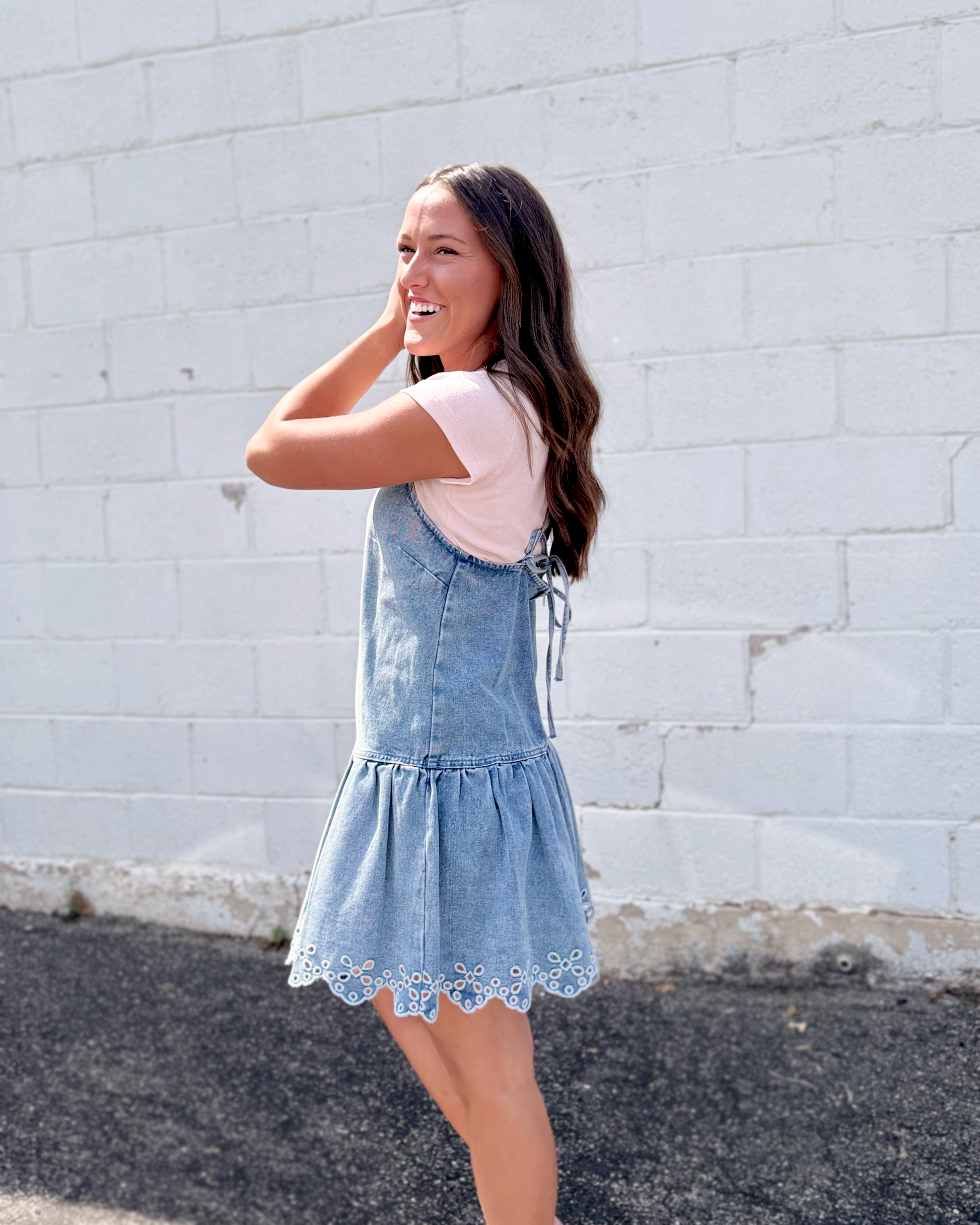 light blue denim pinafore-style mini dress