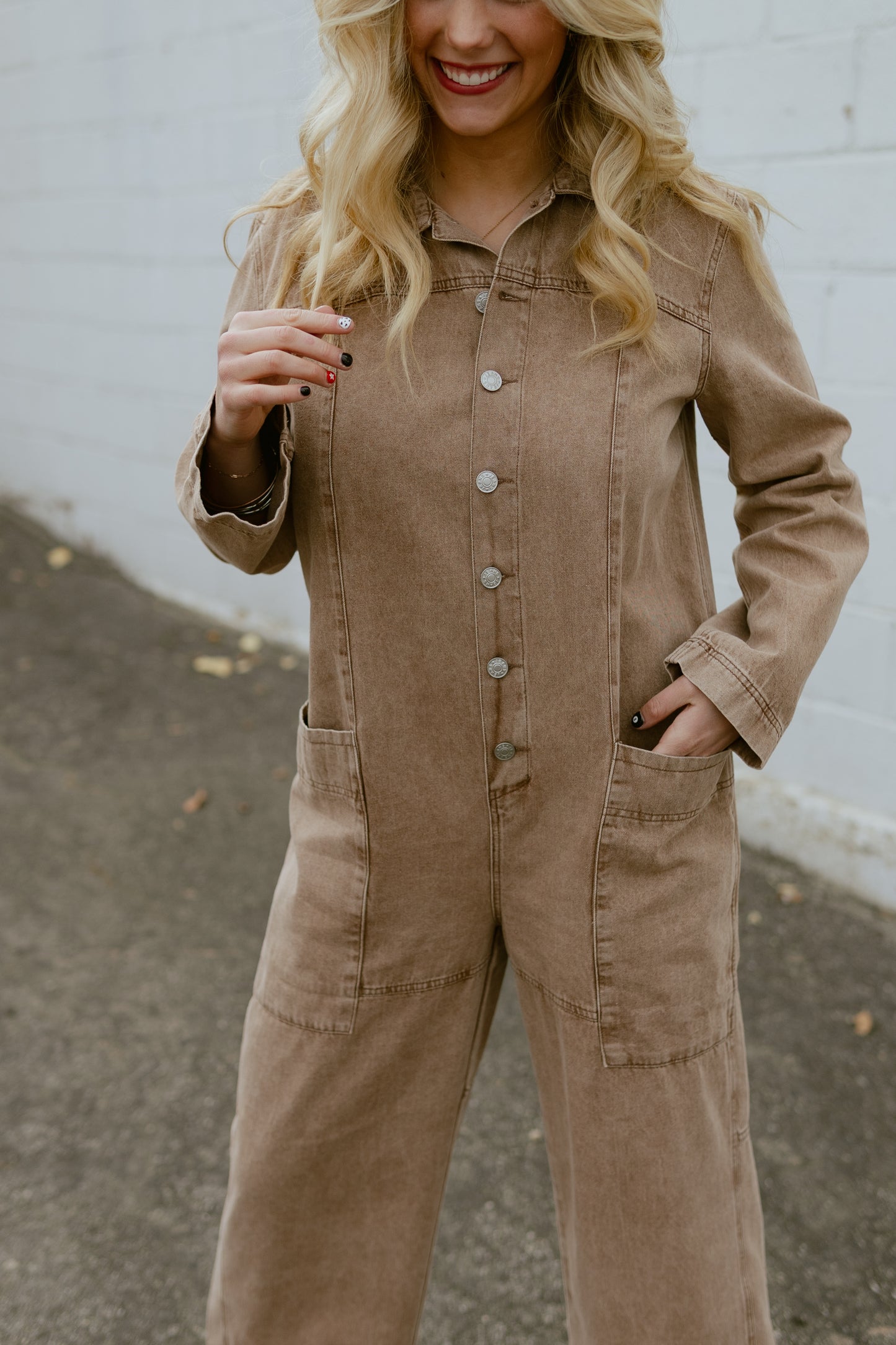 Tan jumpsuit, button up with long sleeves