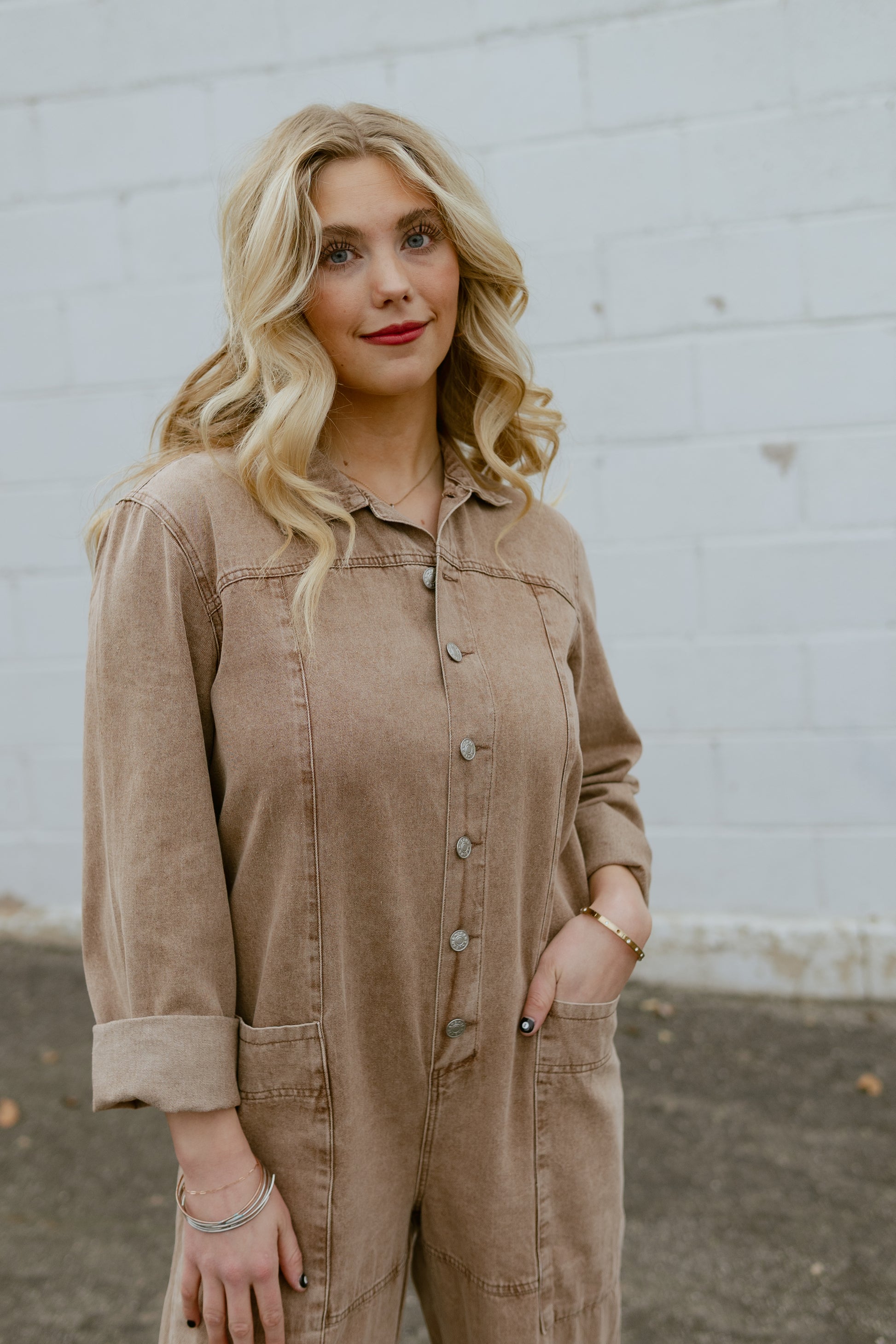Tan jumpsuit, button up with long sleeves