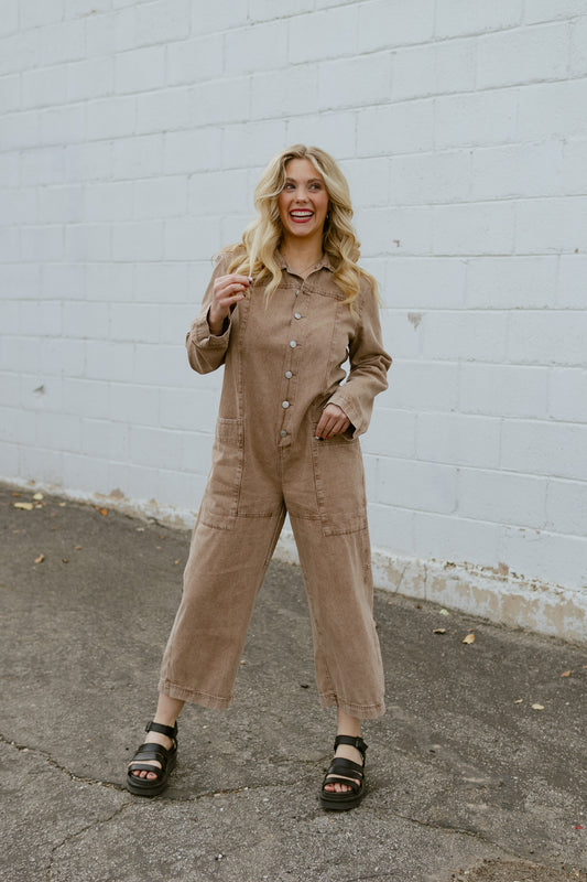 Tan jumpsuit, button up with long sleeves