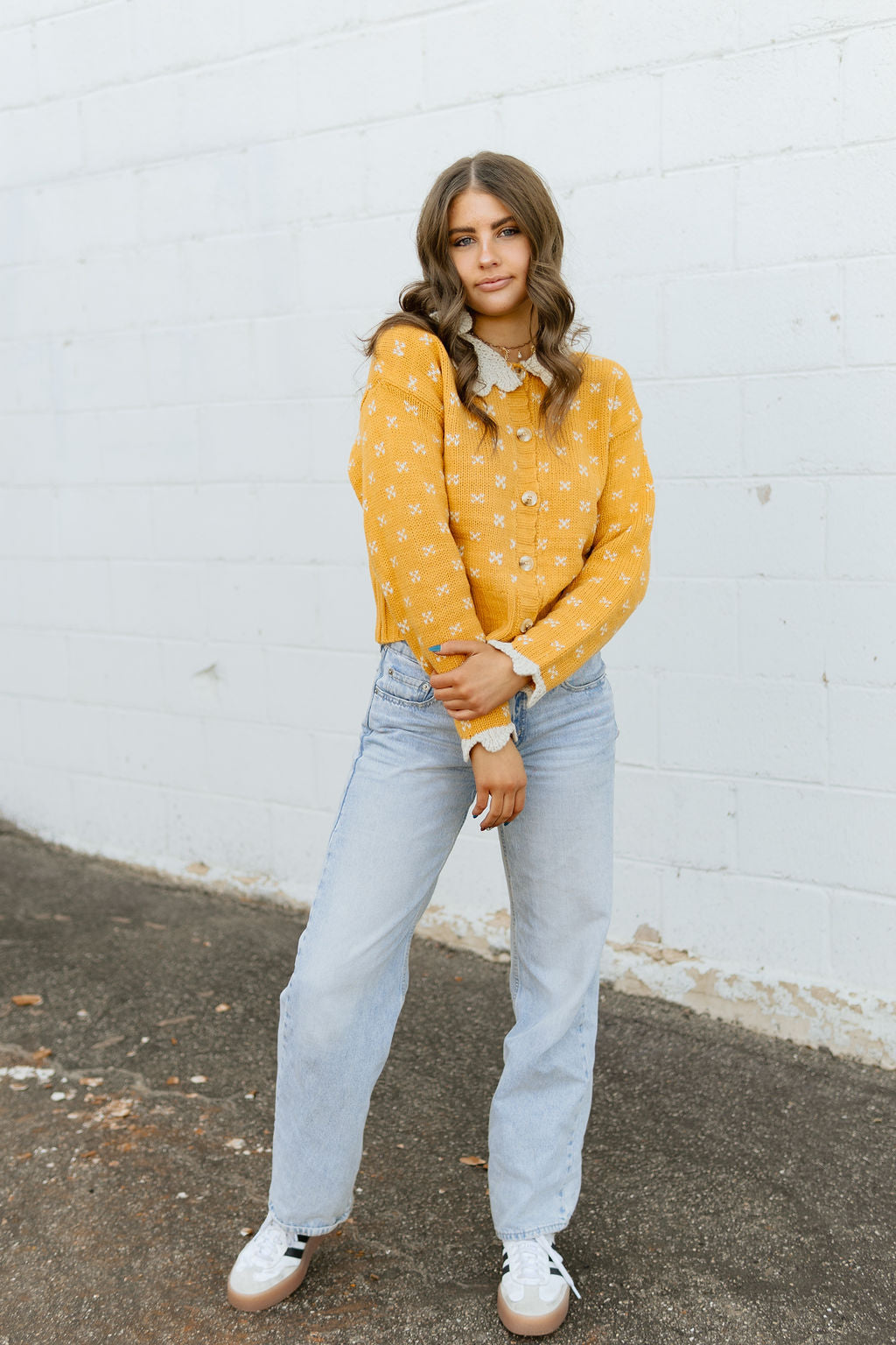 yellow button up sweater with scalloped knit collar and sleeves