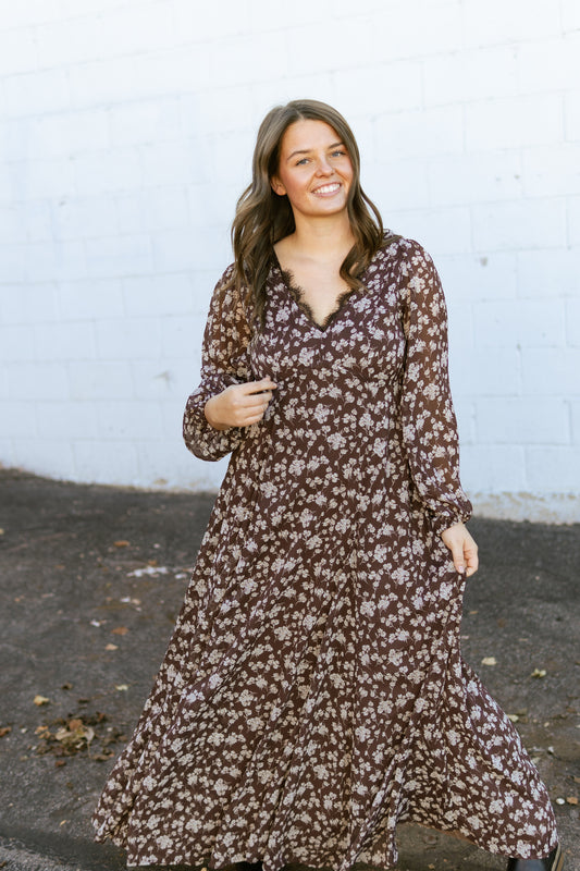 brown floral v-neck dress with lace detail along the neck line