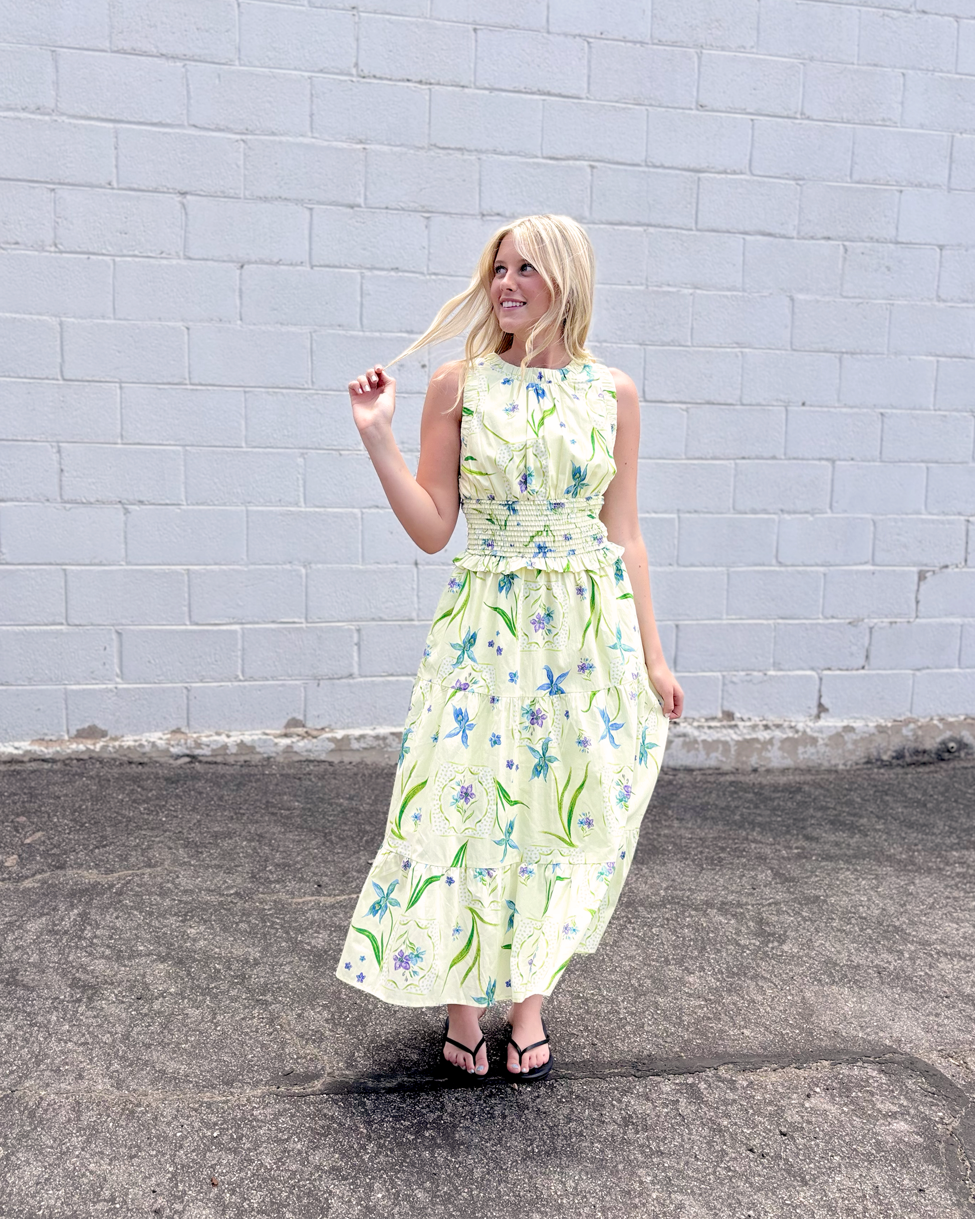 yellow green sleeveless dress with purple and blue floral print