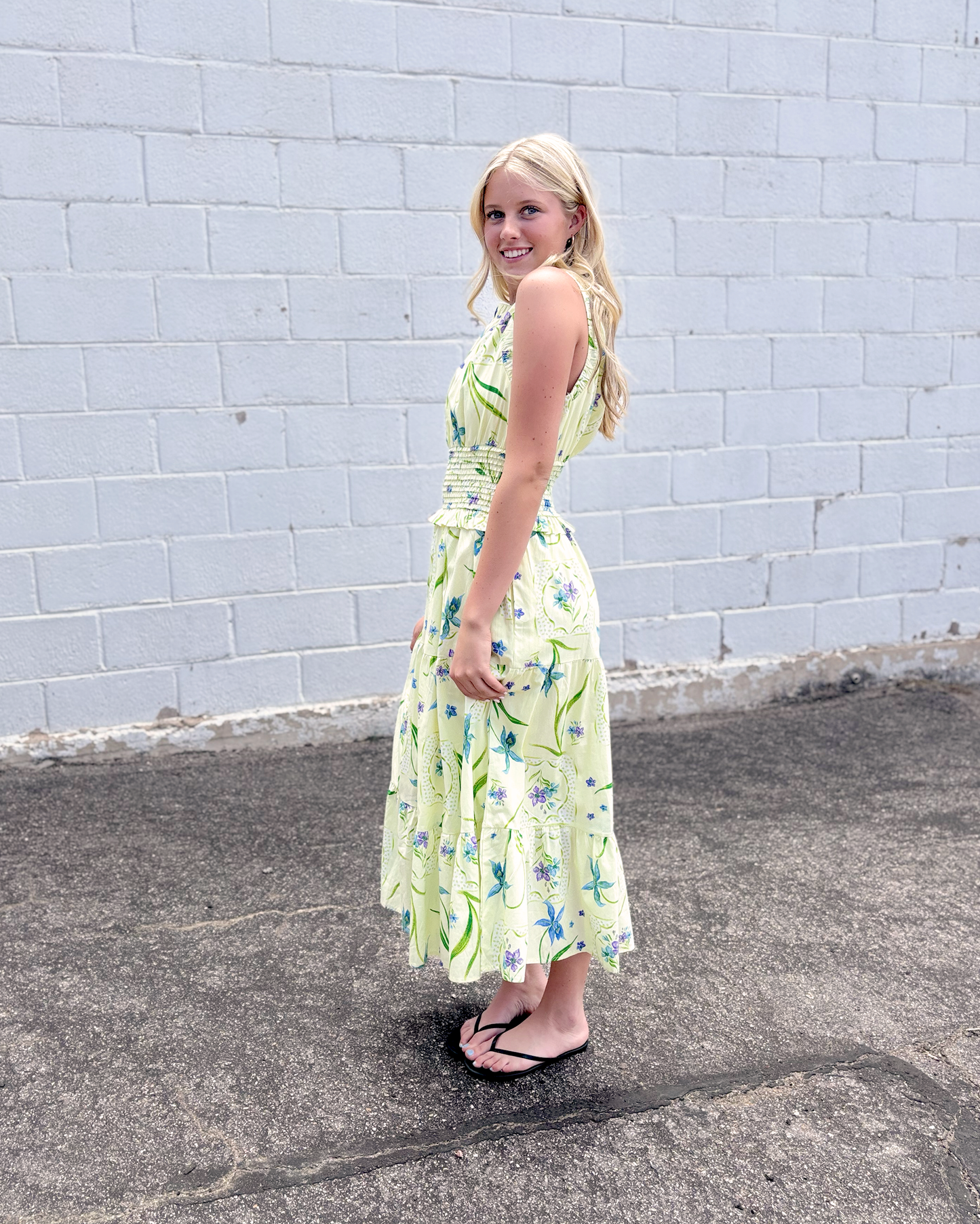 yellow green sleeveless dress with purple and blue floral print