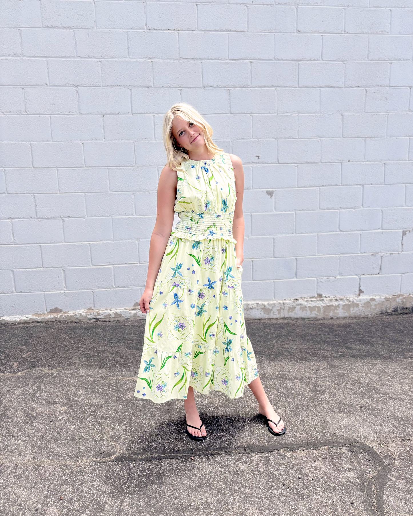 yellow green sleeveless dress with purple and blue floral print