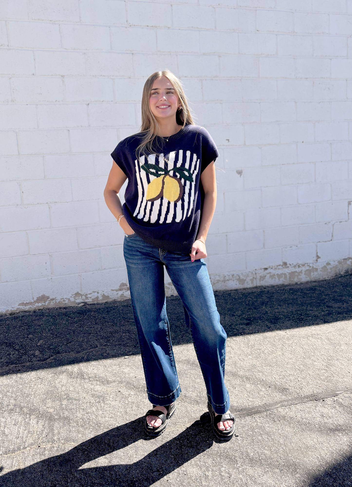 Navy sweater vest with lemon on the front