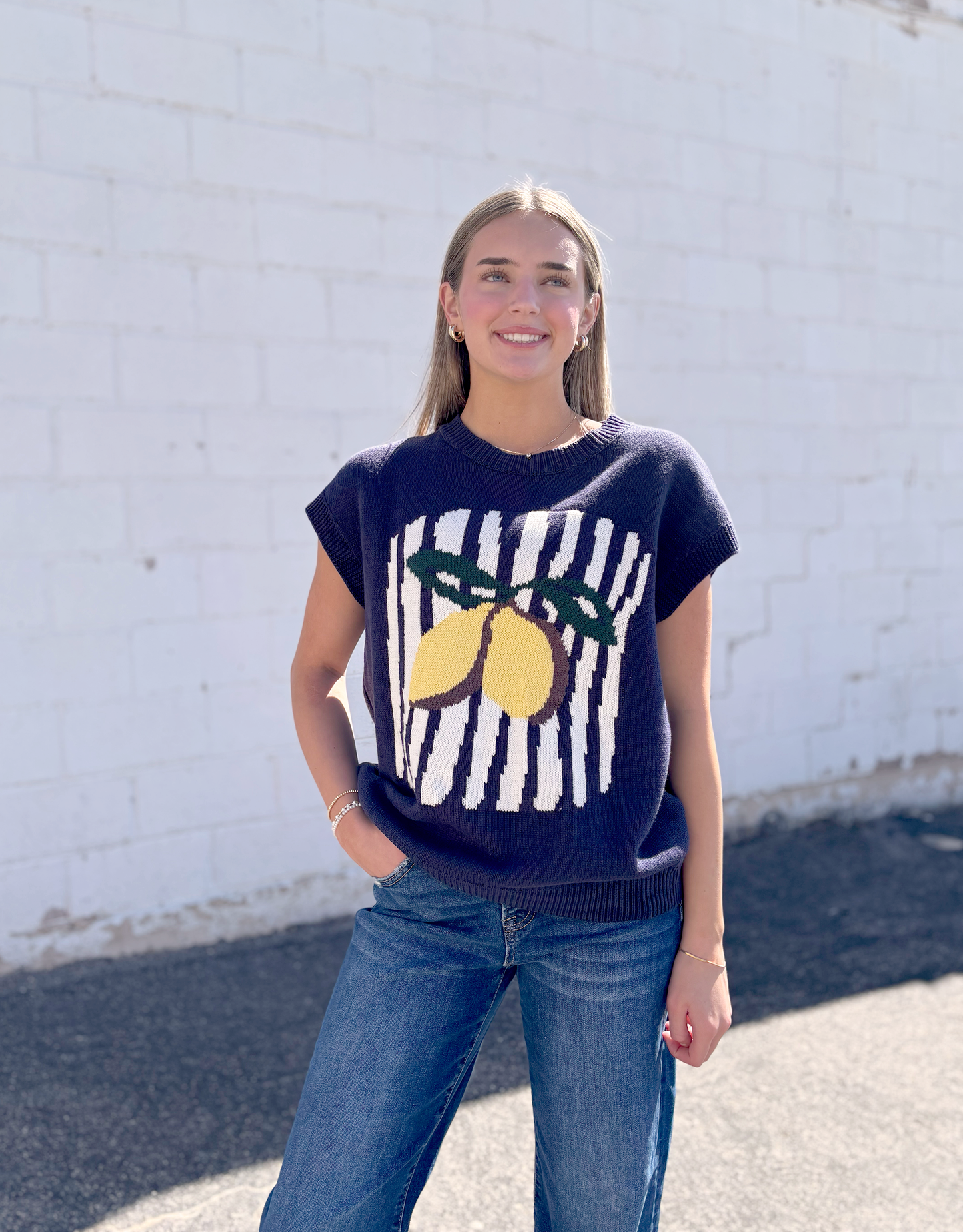 Navy sweater vest with lemon on the front