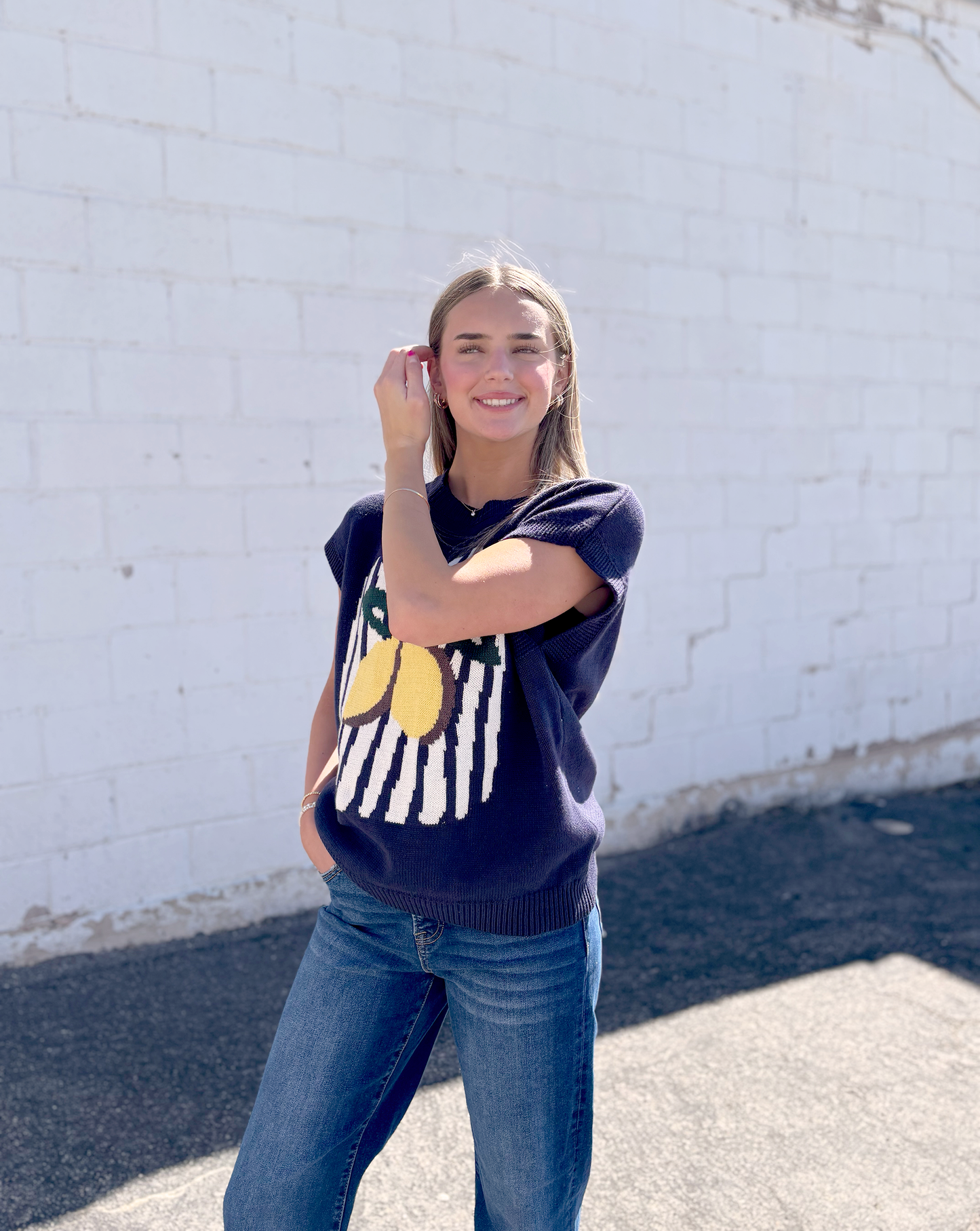 Navy sweater vest with lemon on the front