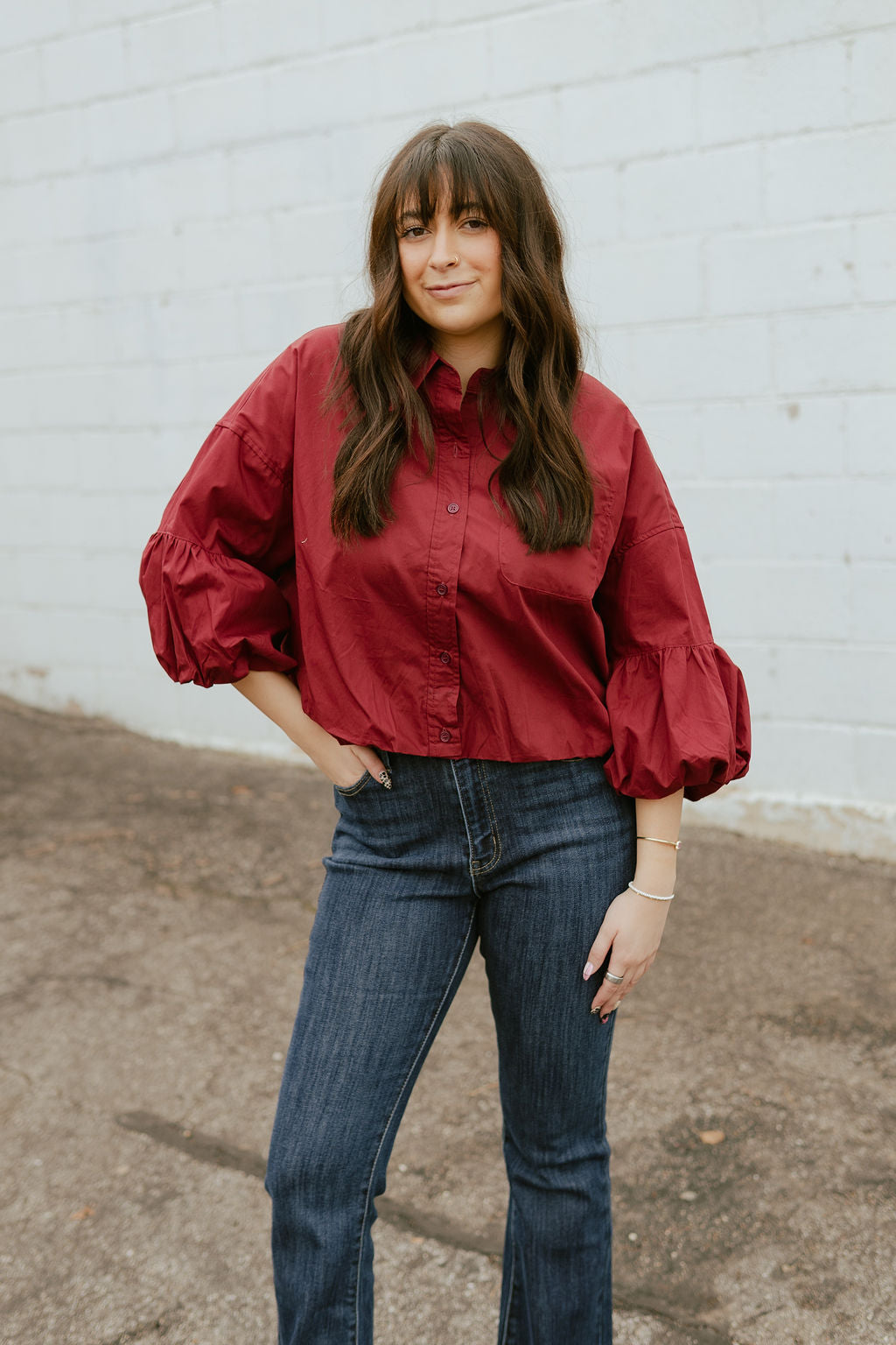 Deep red top with balloon sleeves and a slight crop