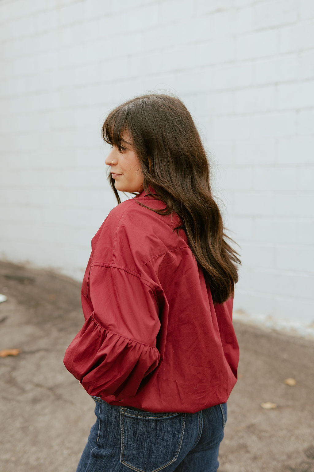 Deep red top with balloon sleeves and a slight crop