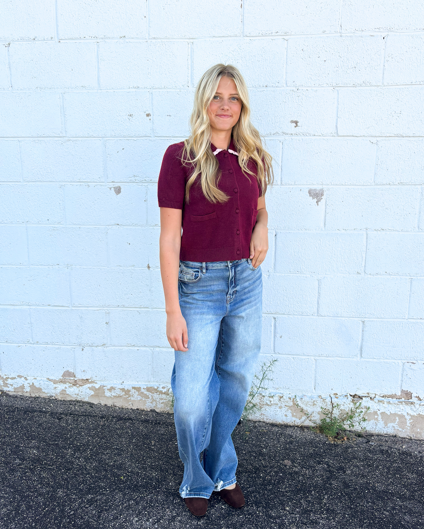 cute maroon button up cropped sweater with pink lace trimming the collar