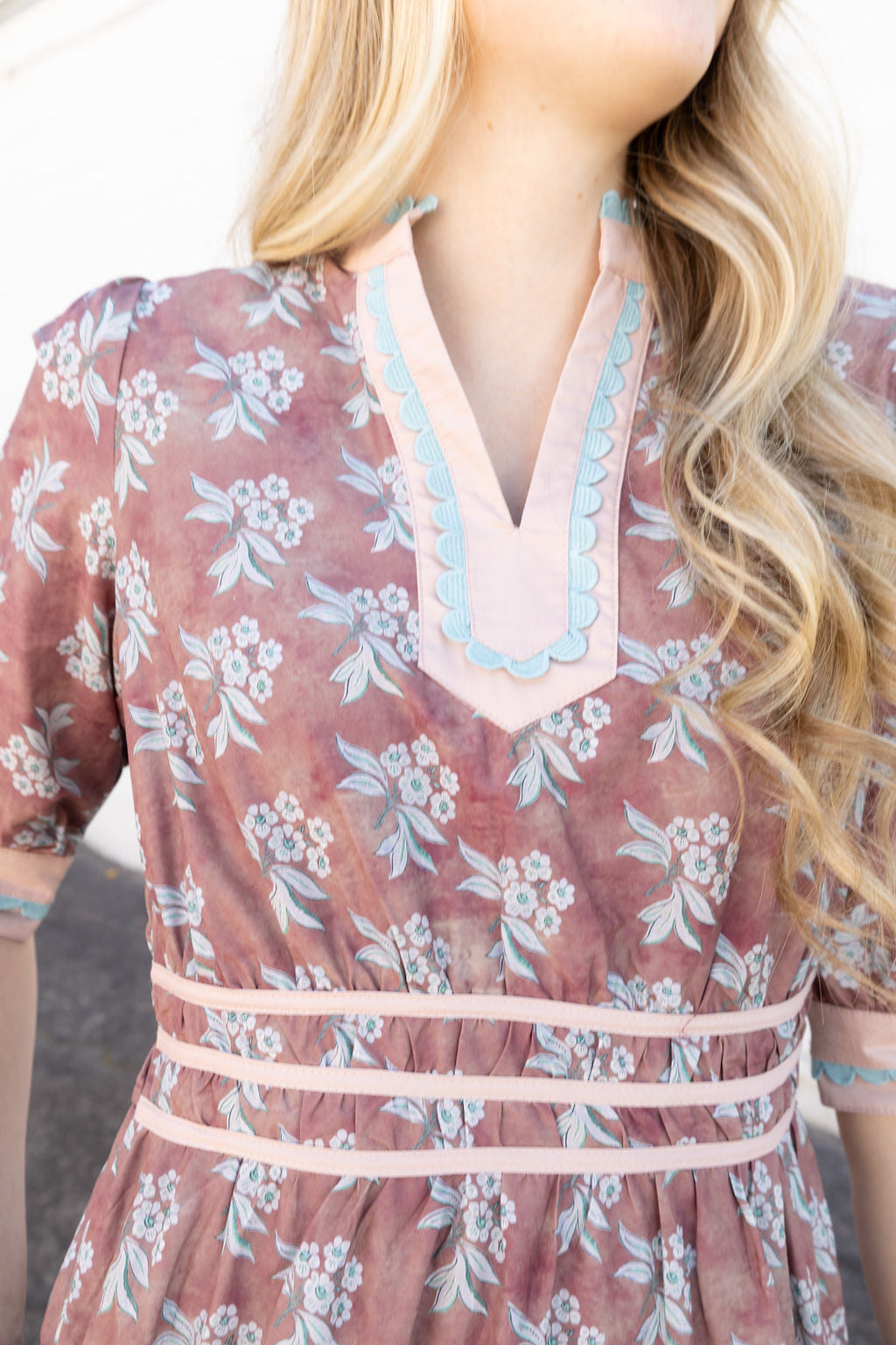Mauve dress with white and teal floral details