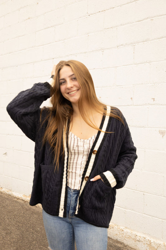 Navy cardigan with white stripe along front and sleeves