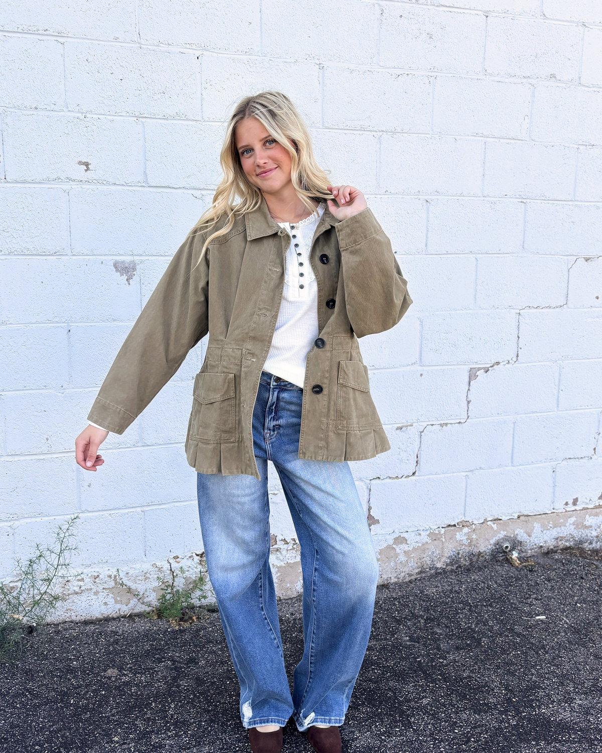 Olive jacket with cinched waist with pleats on the front and back