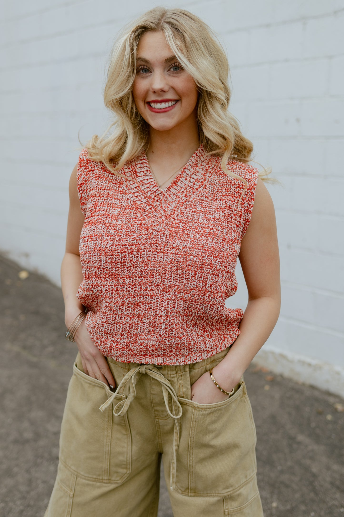 Orange knit sleeveless sweater