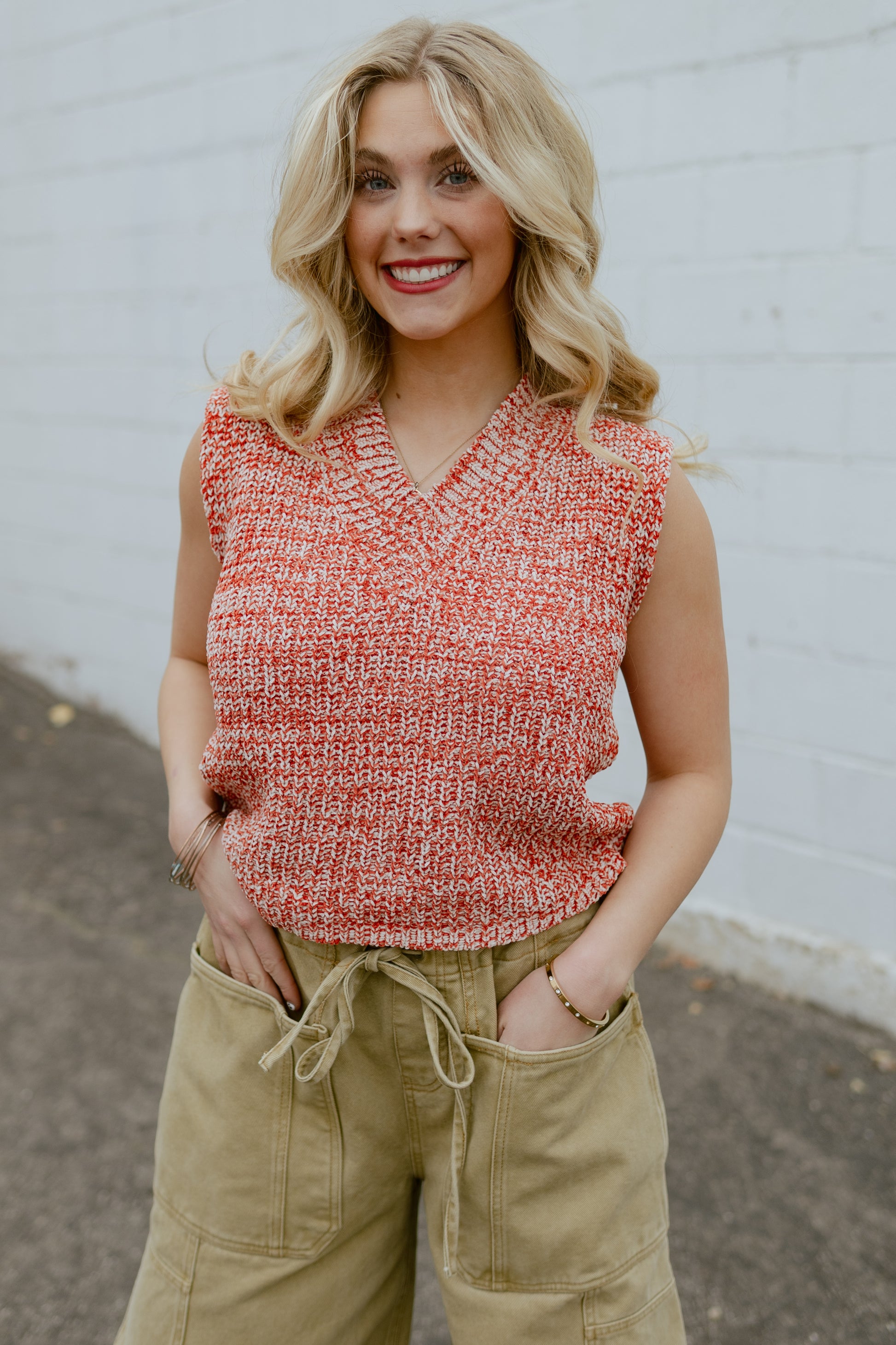 Orange knit sleeveless sweater