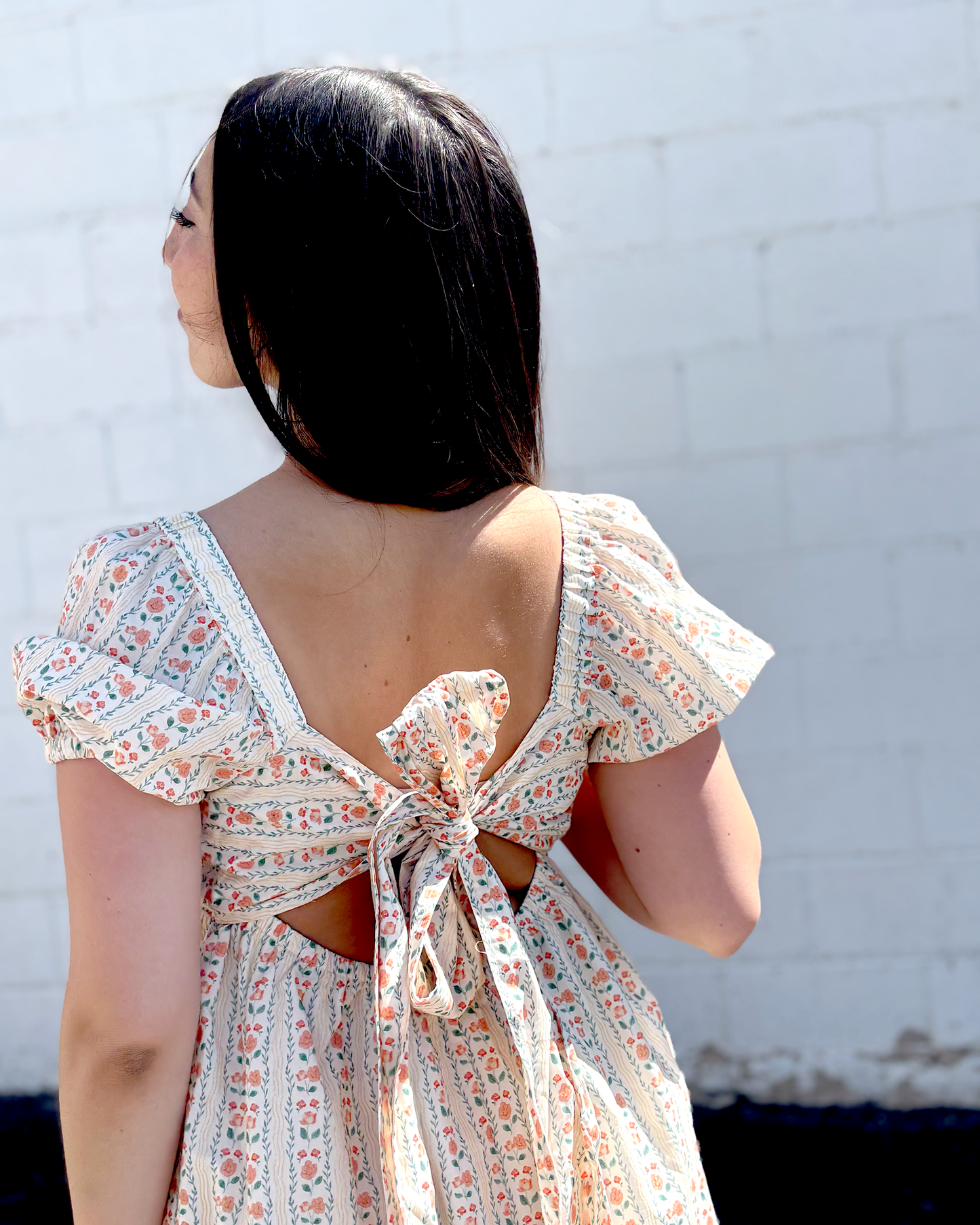 Short floral summer dress with puff sleeves and an empire waist