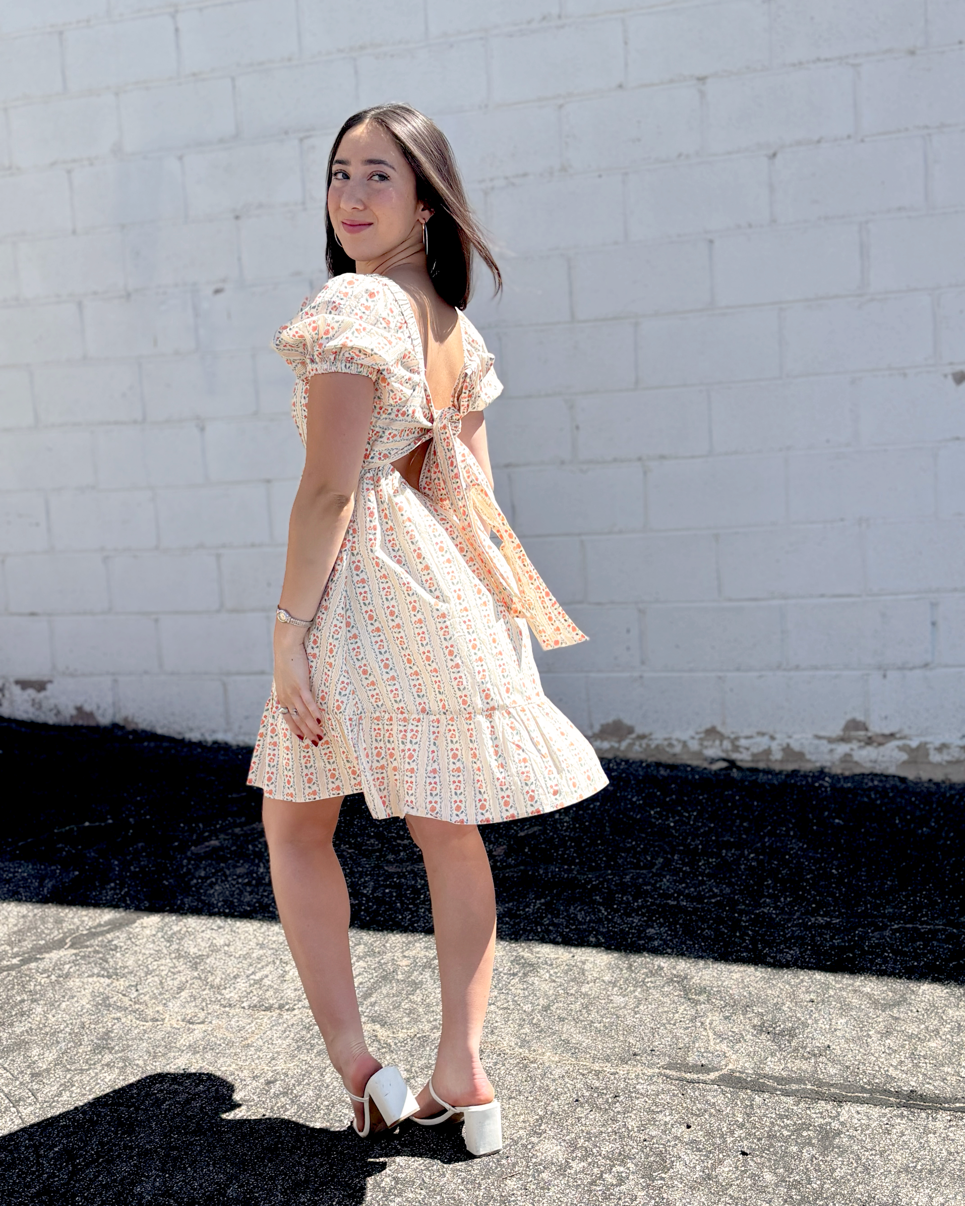 Short floral summer dress with puff sleeves and an empire waist