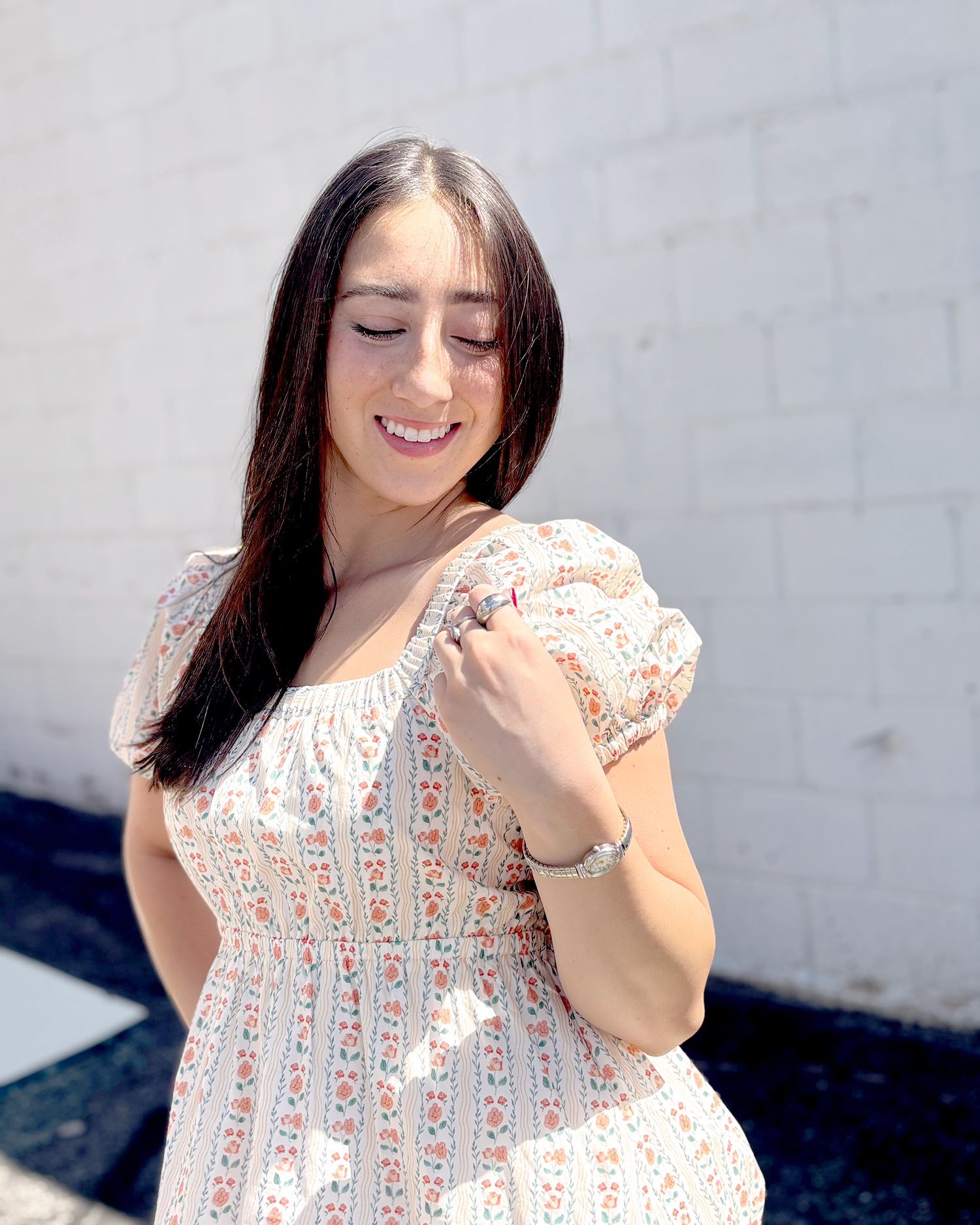 Short floral summer dress with puff sleeves and an empire waist