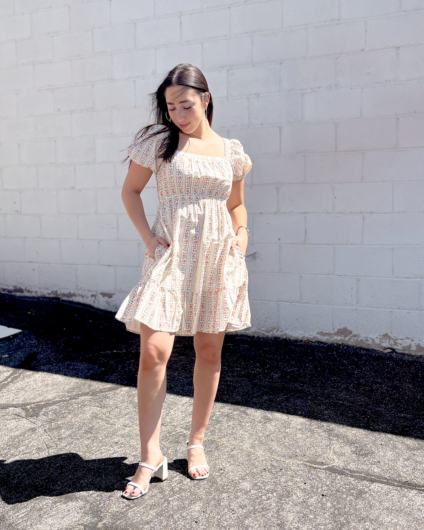 Short floral summer dress with puff sleeves and an empire waist