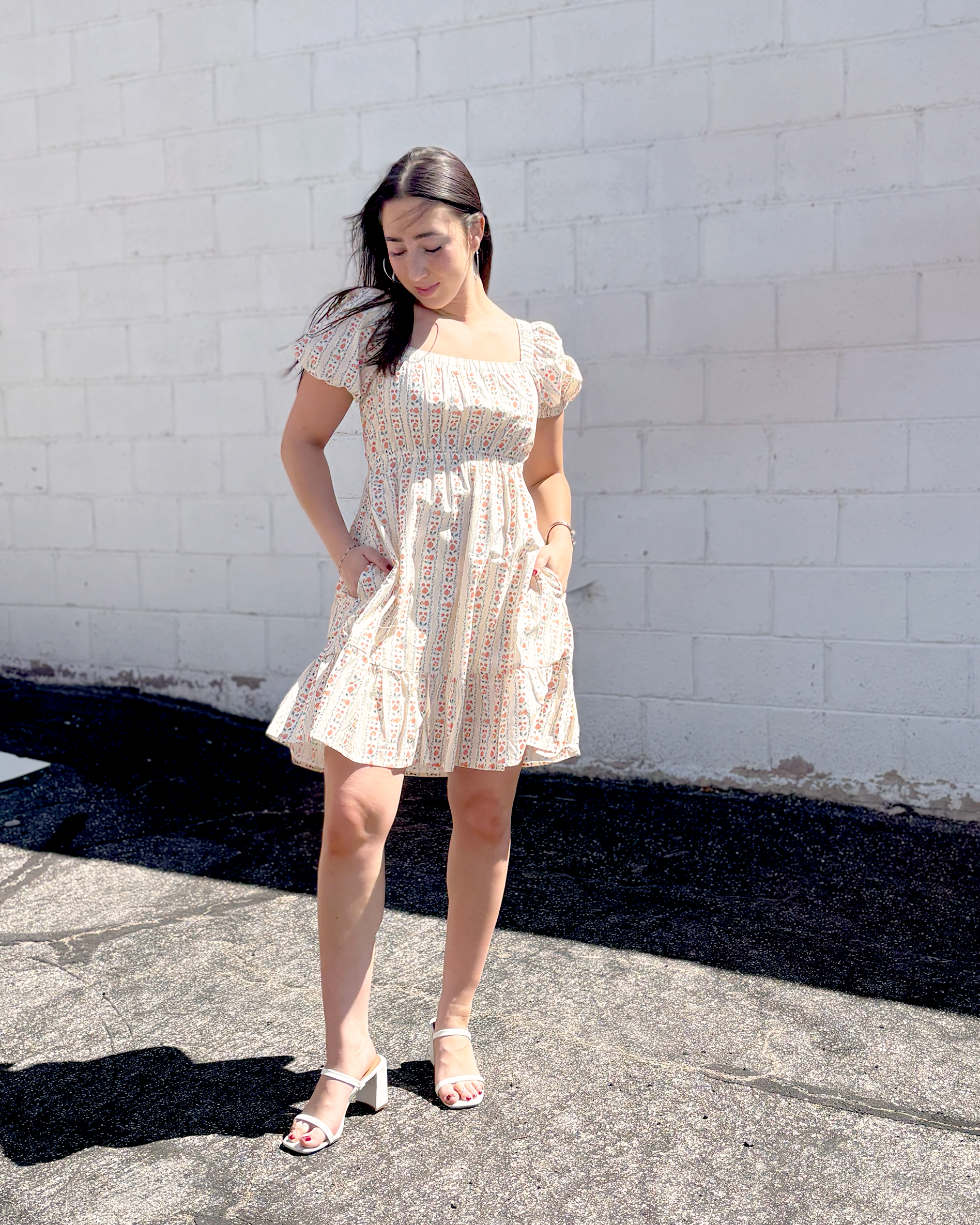 Short floral summer dress with puff sleeves and an empire waist